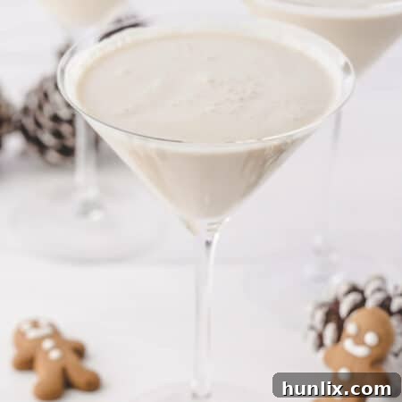 A glass of the recipe surrounded by holiday decor.