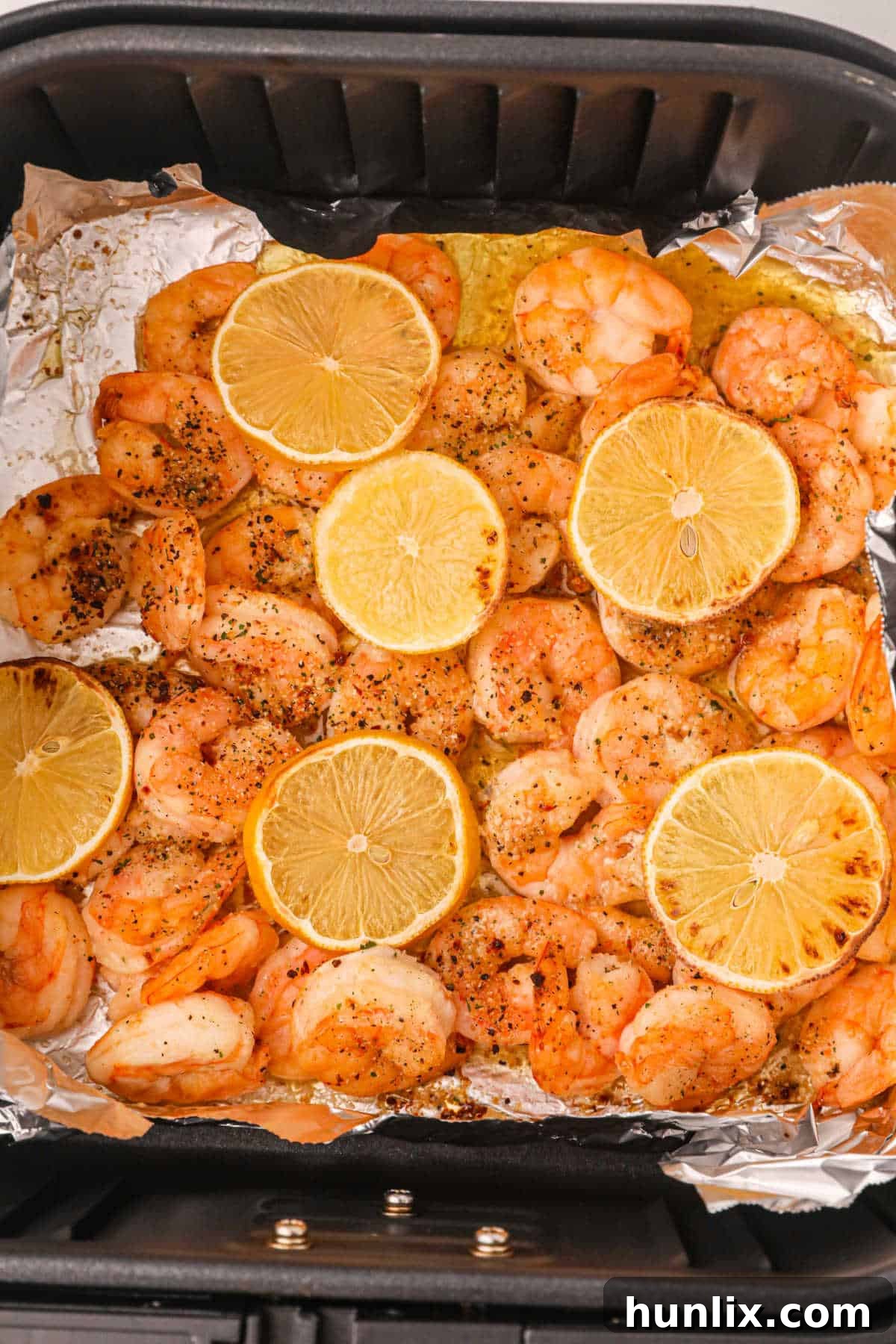 Crispy Air Fryer Shrimp 2 Close up of perfectly cooked, seasoned air fryer shrimp, glistening and ready to eat.