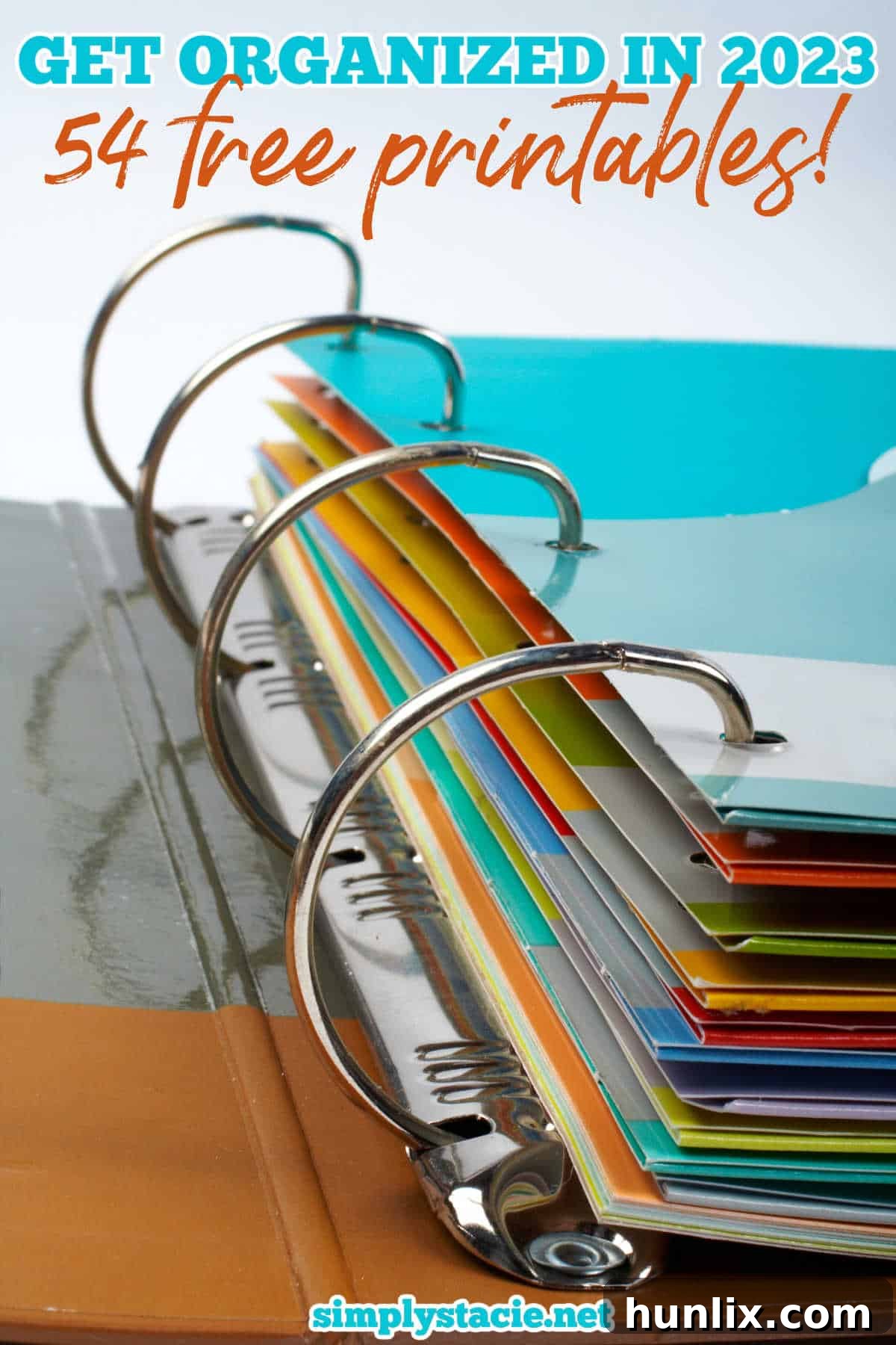 A vibrant display of colorful dividers in a three-ring binder, symbolizing efficient organization and planning with free printable templates.