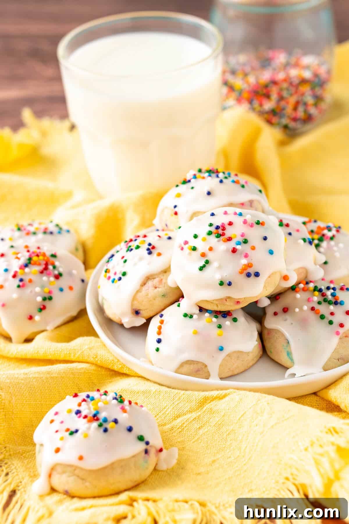 Sweetened condensed milk cookies artfully arranged on a white plate, showcasing their soft texture and delicate sweetness.