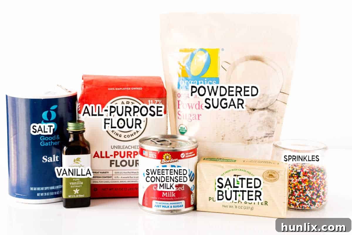 A curated display of essential ingredients on a pristine white background, ready for baking sweetened condensed milk cookies.