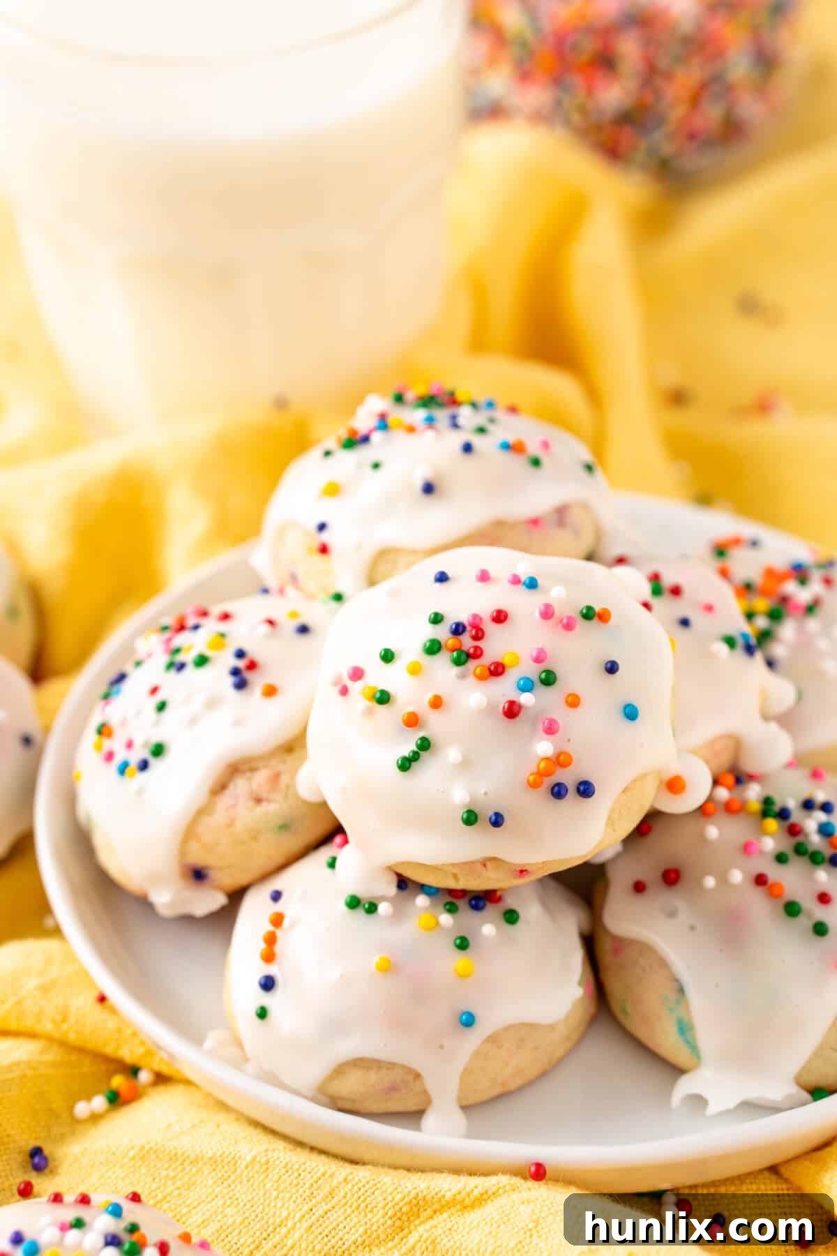 A beautifully arranged plate of golden-brown sweetened condensed milk cookies, highlighting their inviting texture and perfect shape.