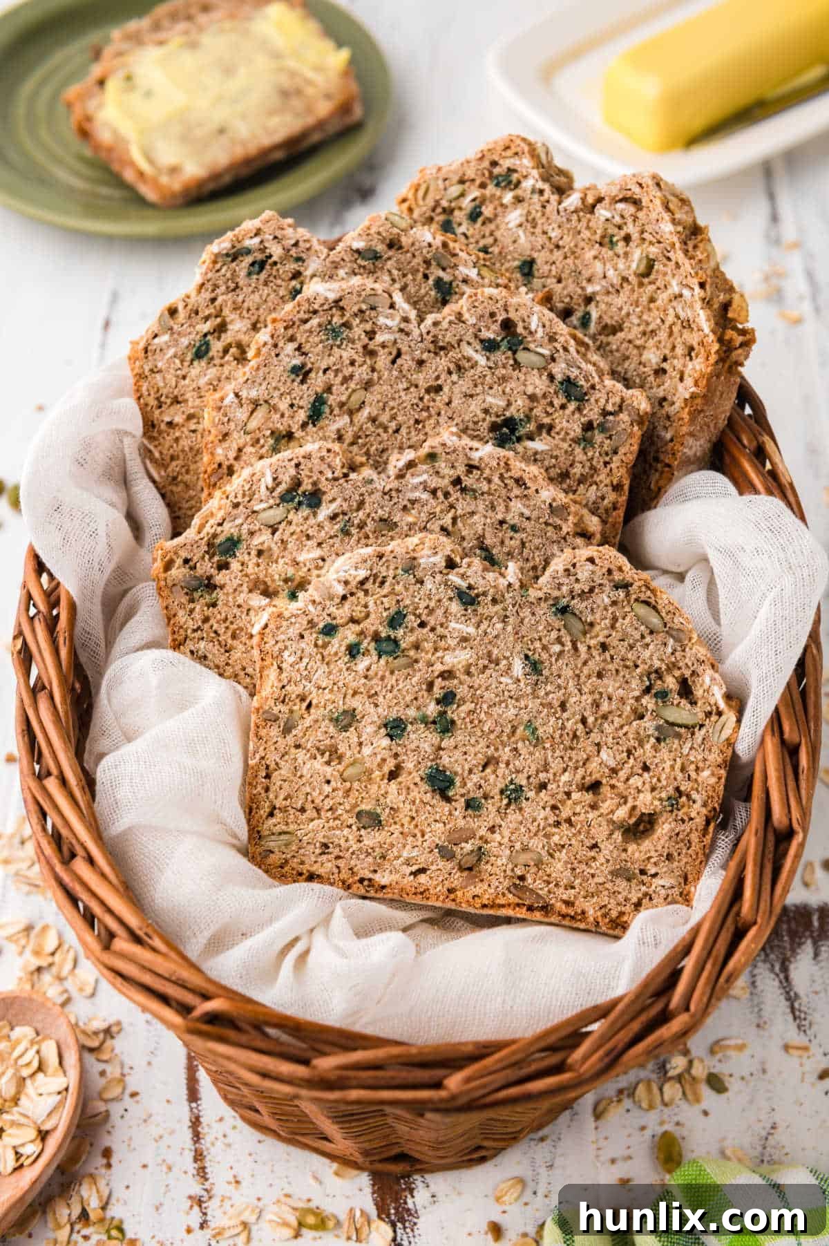 Slices of Irish brown bread arranged appealingly in a rustic basket, highlighting their wholesome texture and inviting appearance.