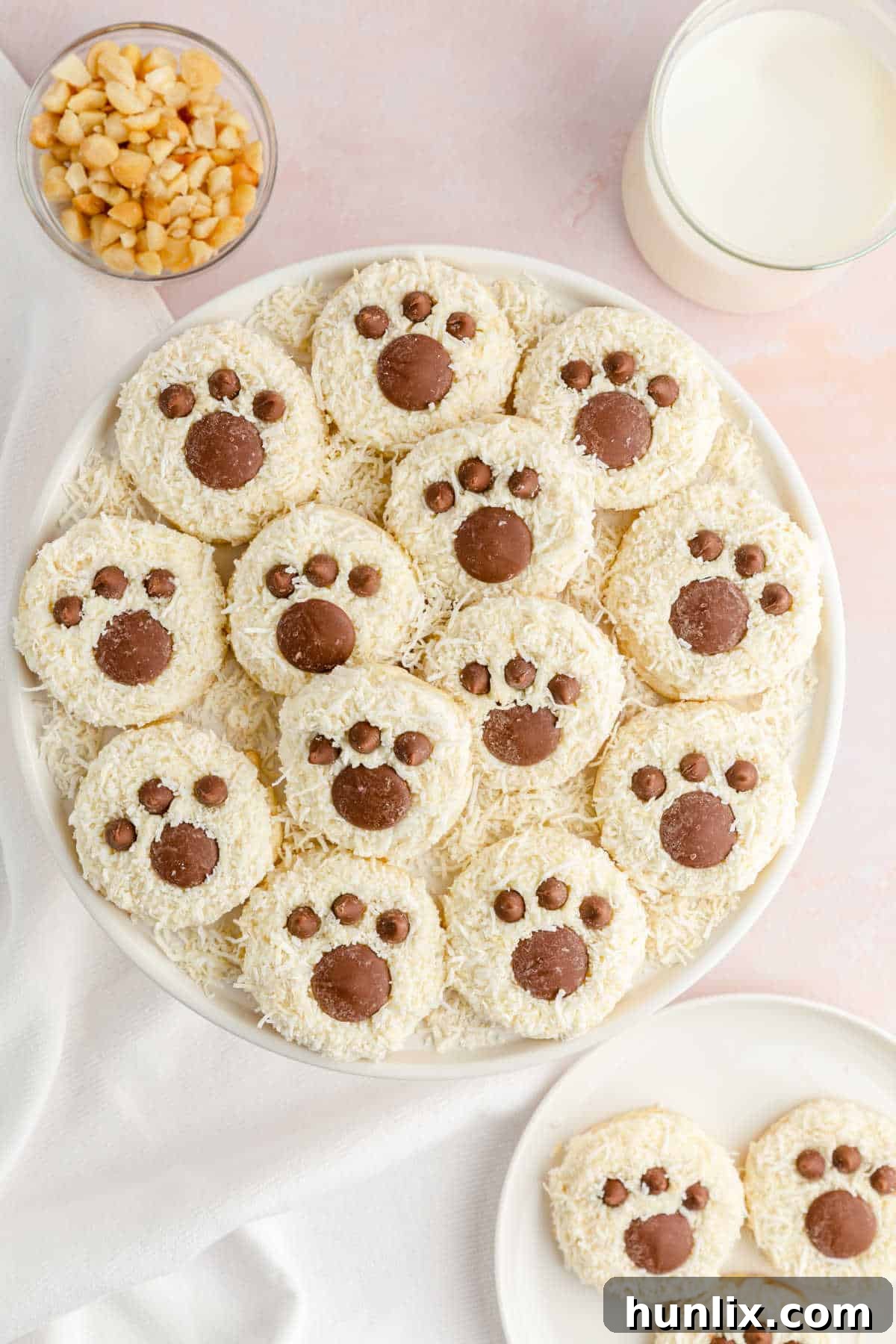 A close-up of a bear paw cookie on a plate.