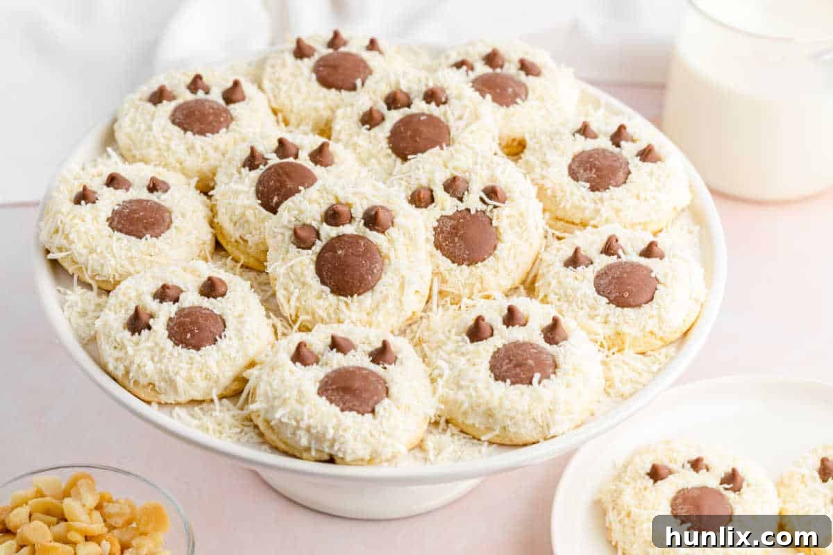 Bear paw cookies displayed on a cake stand.