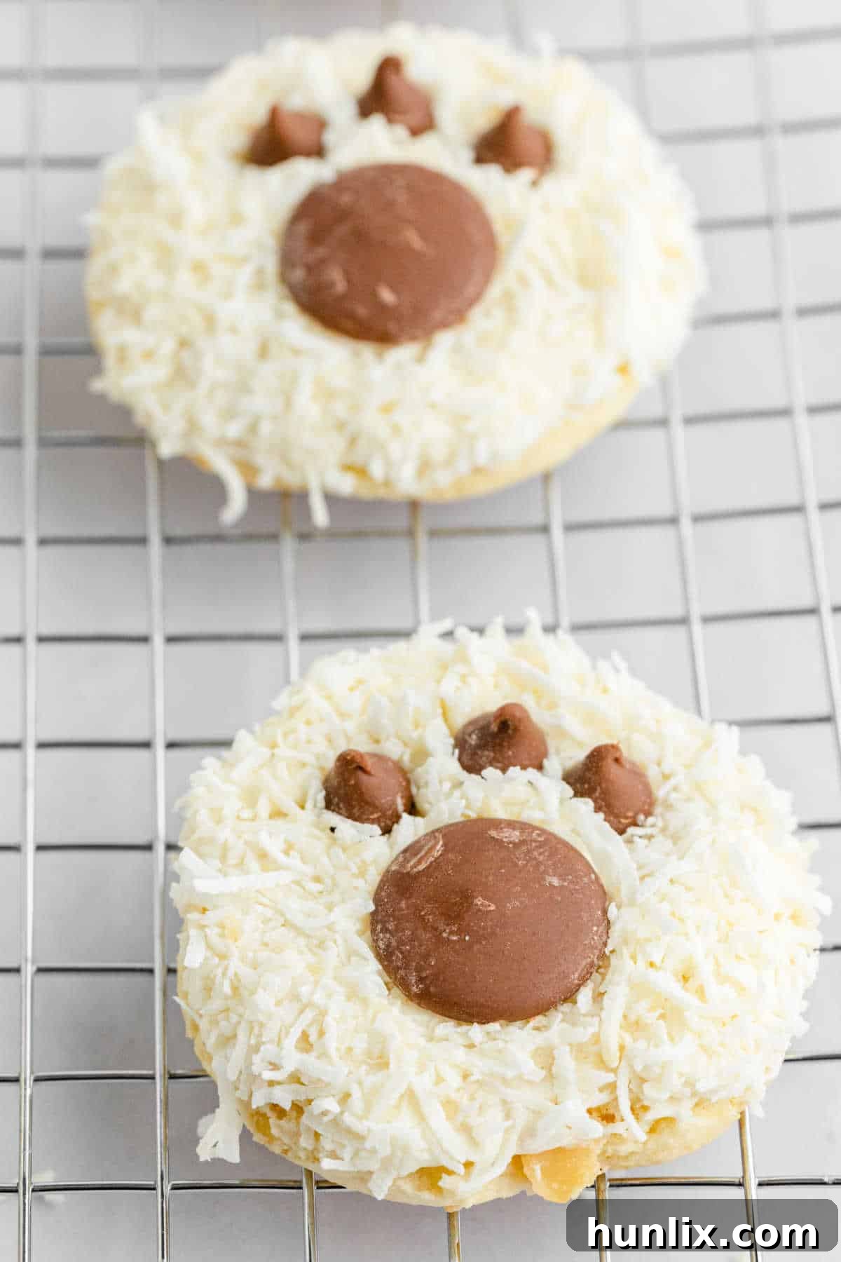 Bear paw cookies cooling on a wire rack.