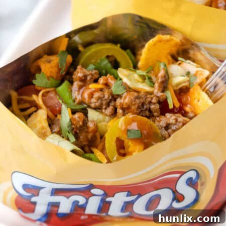 A bag of the recipe on a platter with a spoon inside it.