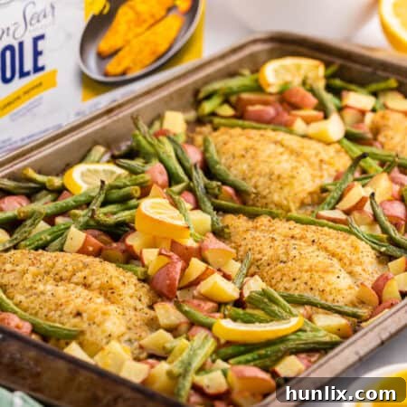 High Liner Lemon Pepper Sole product box next to a cooked sheet pan dinner on a cutting board, ready to be served.