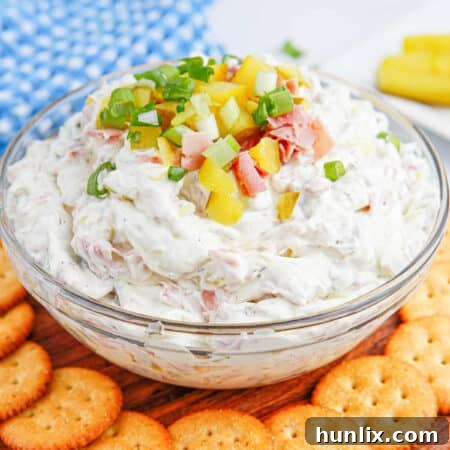 Dill Pickle Dip in a bowl with crackers.