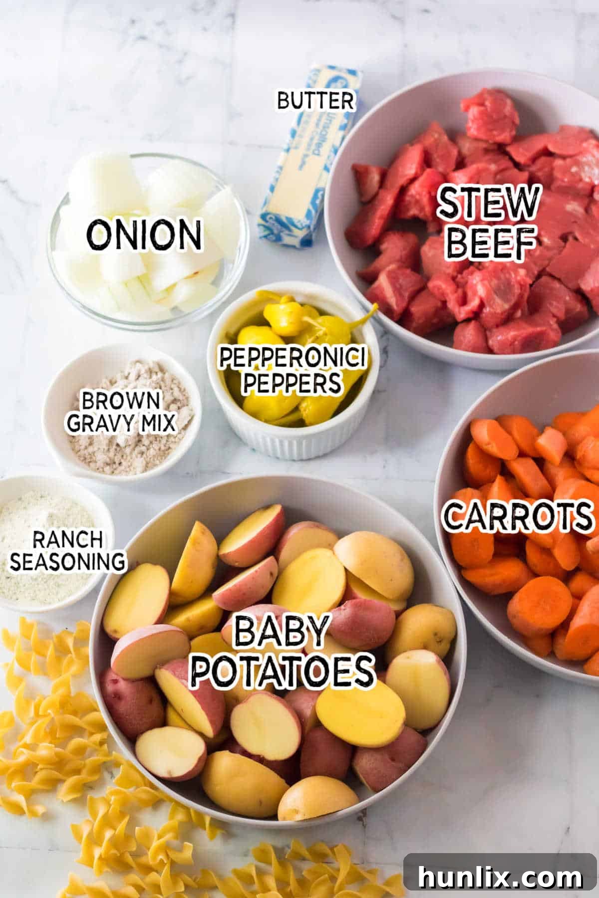 Hearty Slow Cooker Mississippi Sloppy Joes 3 All the fresh ingredients laid out on a wooden board, ready to make Slow Cooker Mississippi Sloppy Joes.