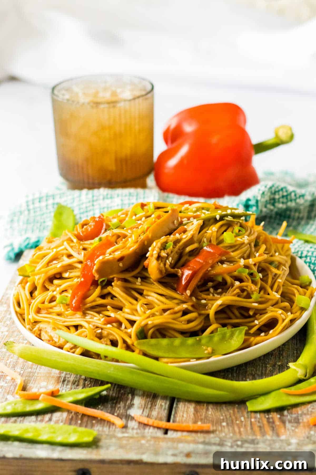A plate of freshly prepared slow cooker chicken lo mein, ready to eat.