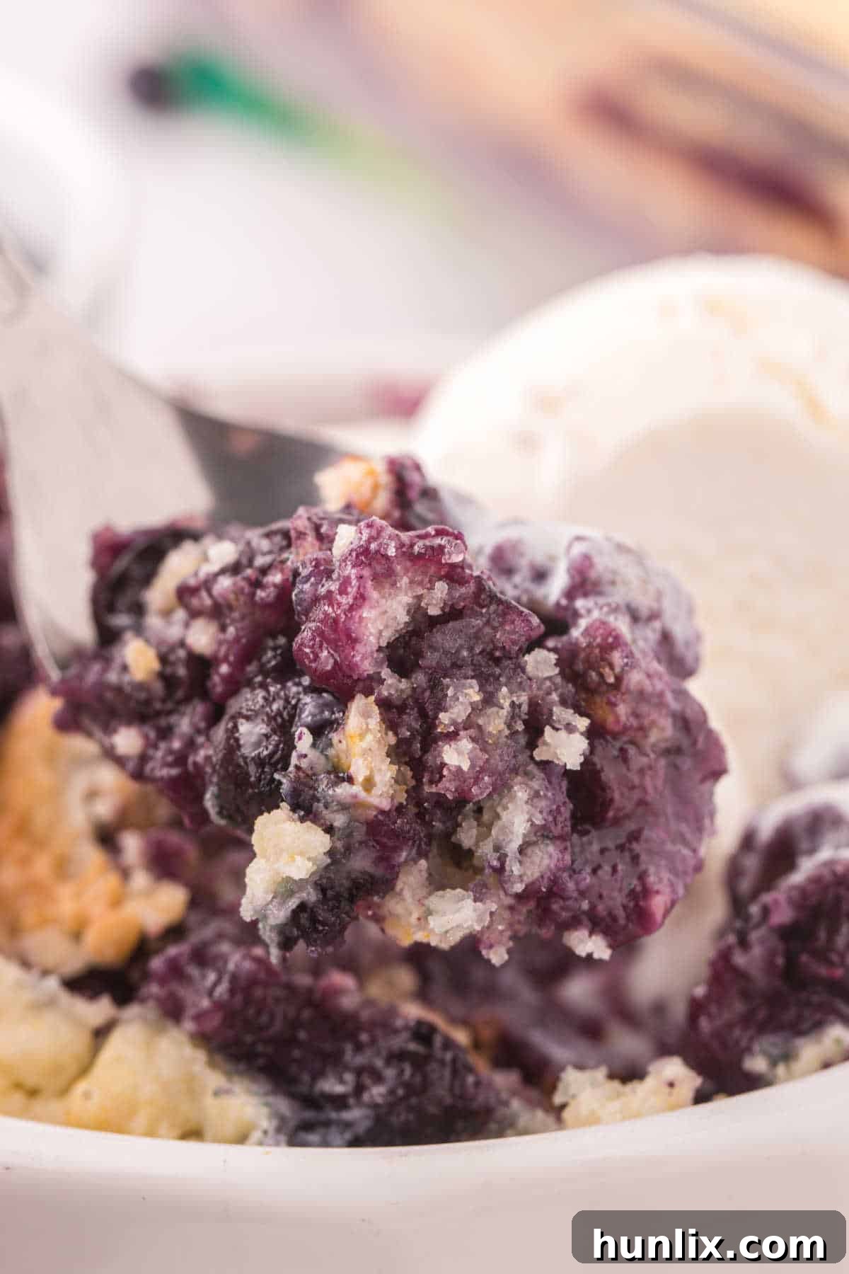 Bursting Blueberry Bliss 9 A scoop of blueberry cobbler.