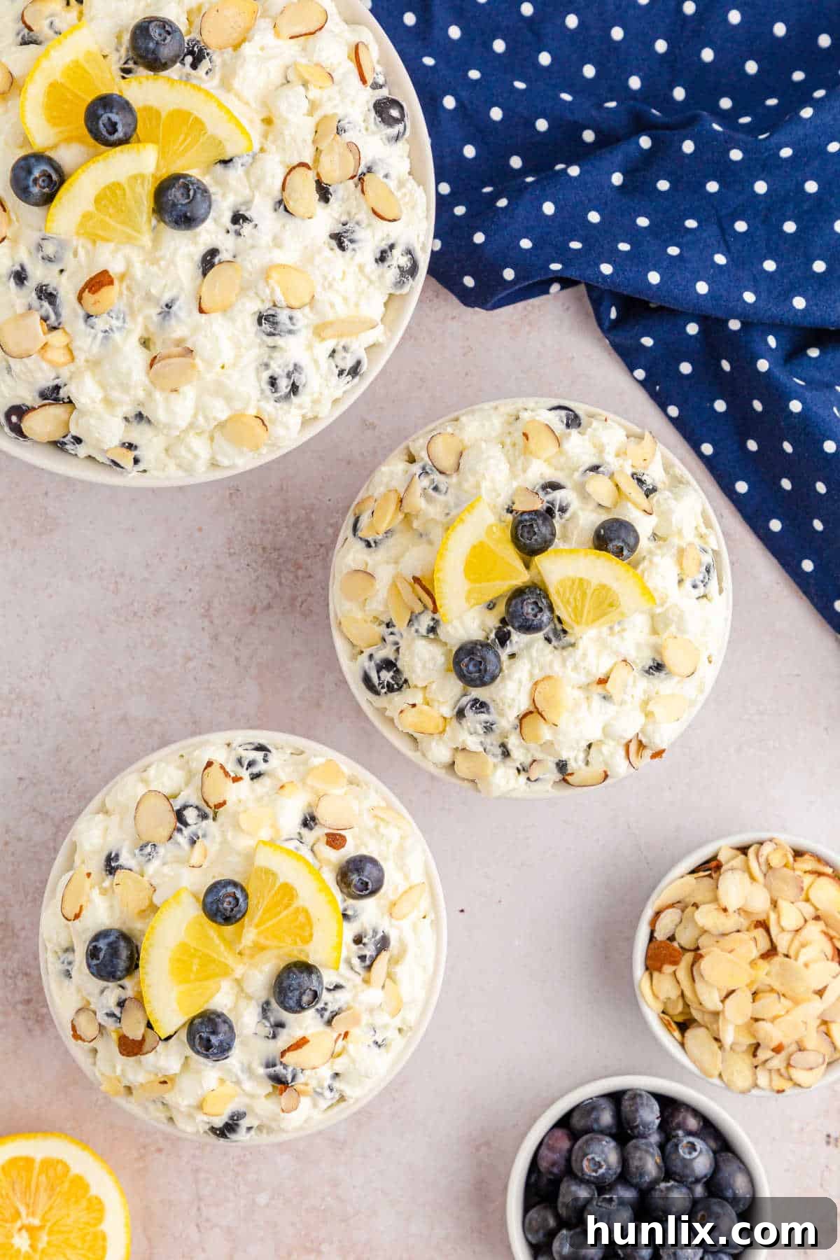 Individual serving bowls of Lemon Blueberry Fluff, indicating it's perfect for portion control and elegant presentation.