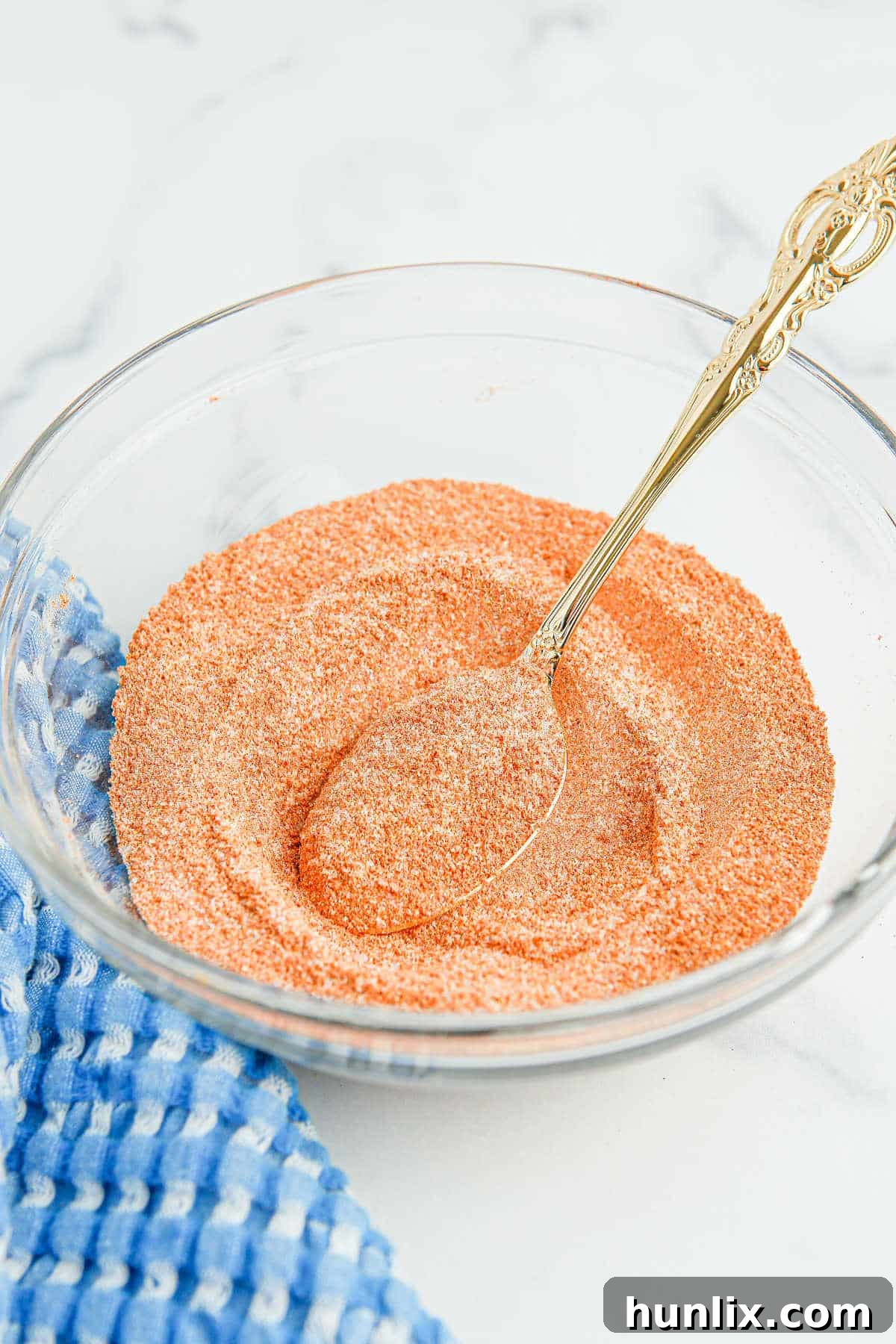 The Perfect Lawrys Inspired Seasoning Blend 2 A bowl of homemade seasoned salt with a spoon, ready for use.