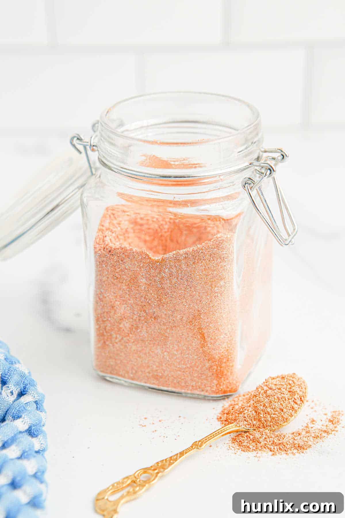 The Perfect Lawrys Inspired Seasoning Blend 5 Copycat Lawry's Seasoned Salt stored in a glass canister.