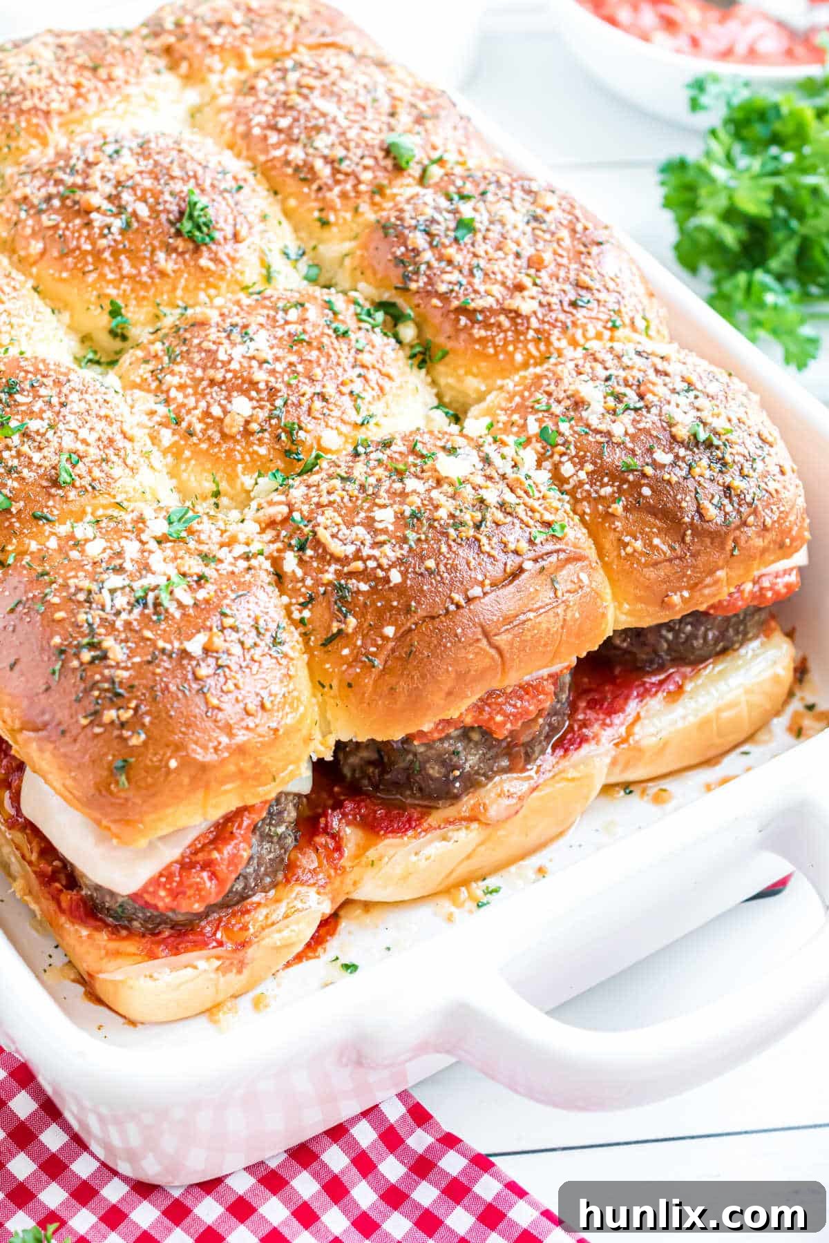 Meatball sliders in a white pan, ready to be served.