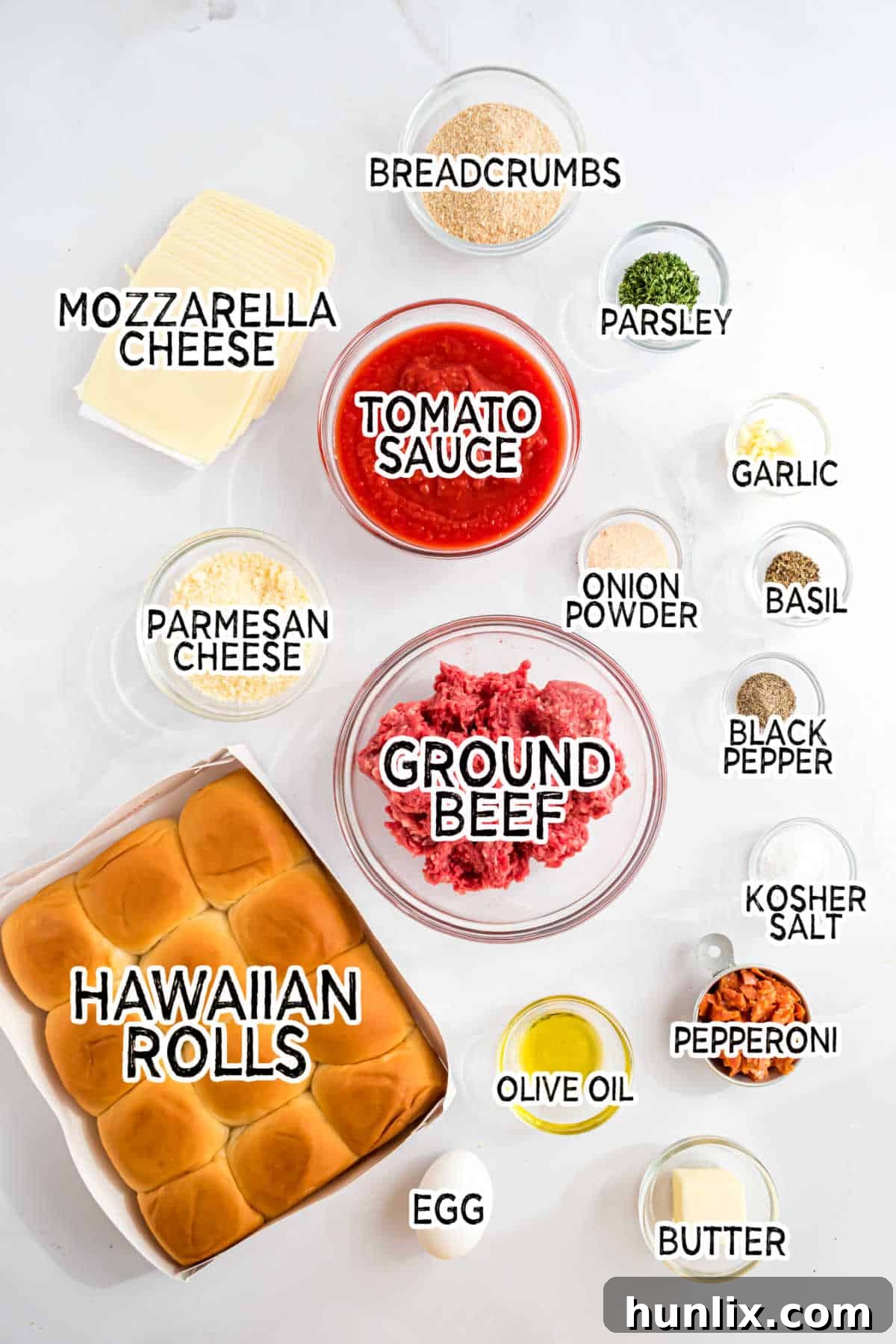Ingredients neatly arranged to make meatball sliders.