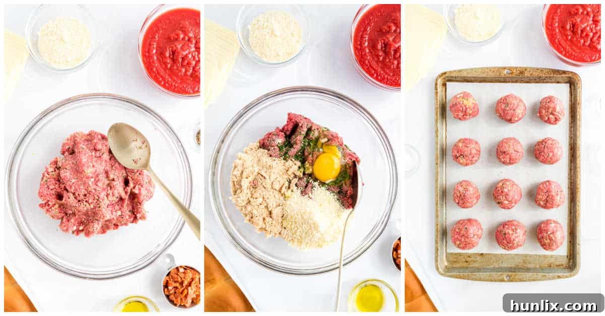 Close-up view of meatballs being prepped on a baking sheet.