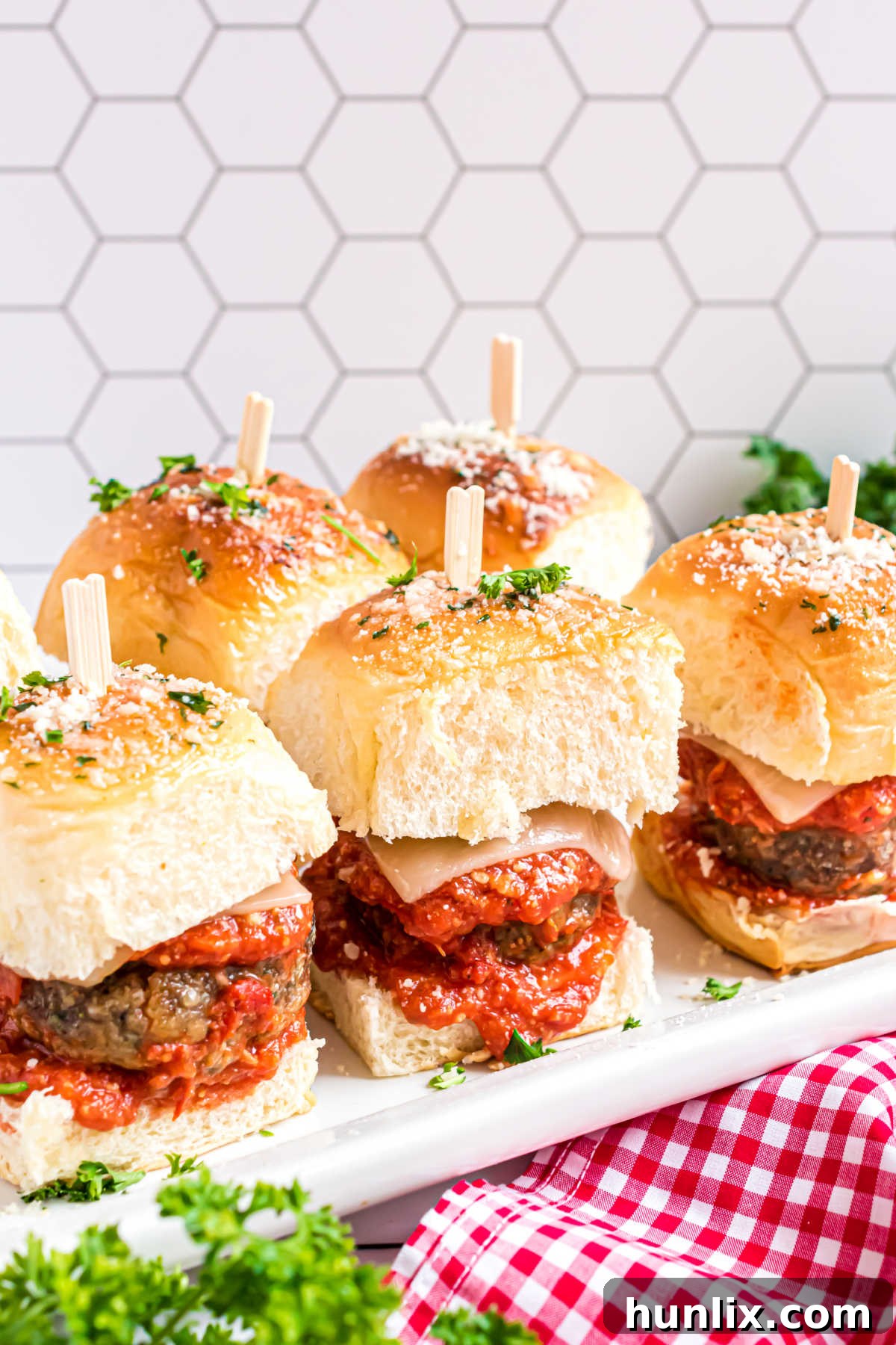 Meatball sliders presented on a platter, ready to be picked up.