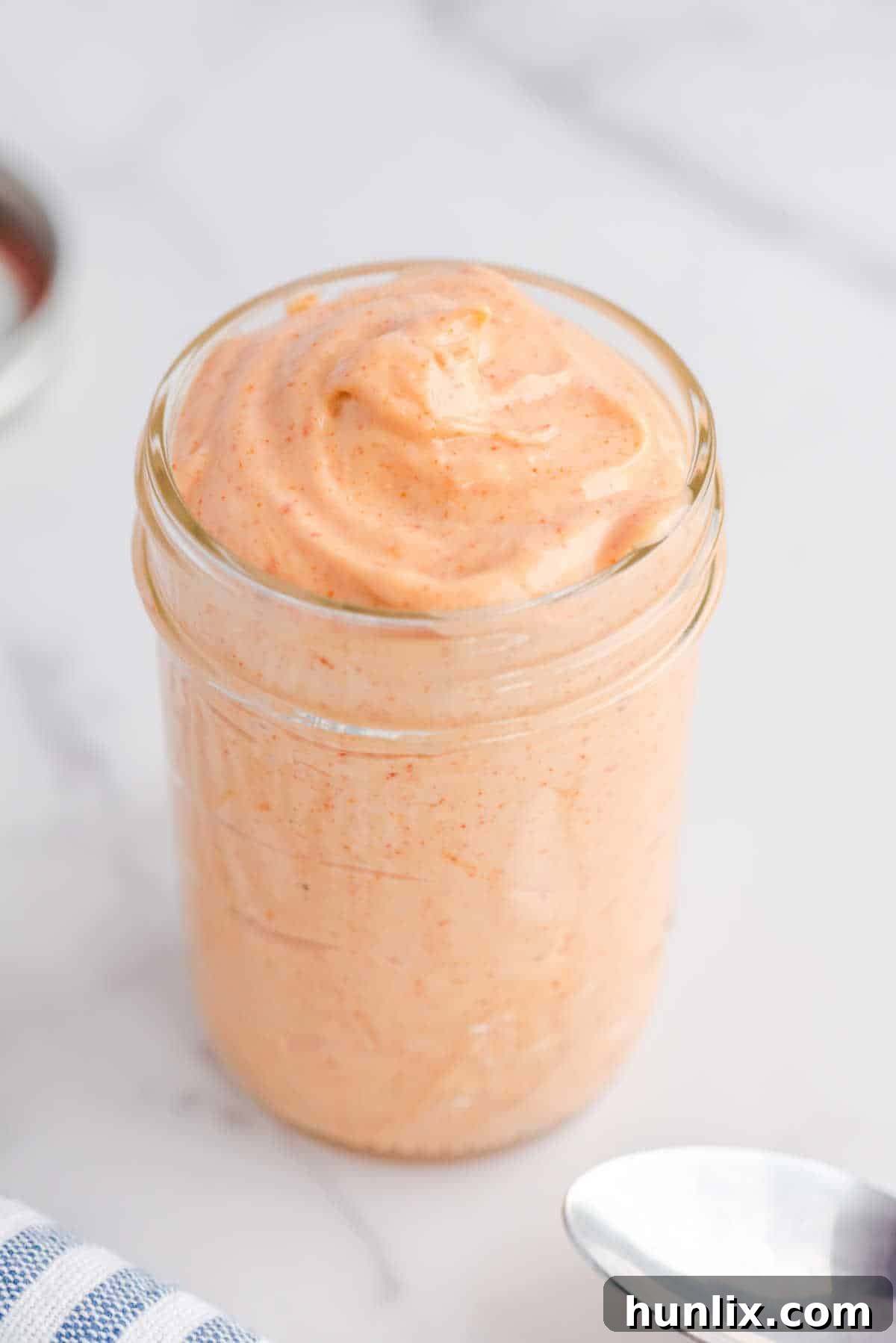 Yum yum sauce stored in a glass jar.