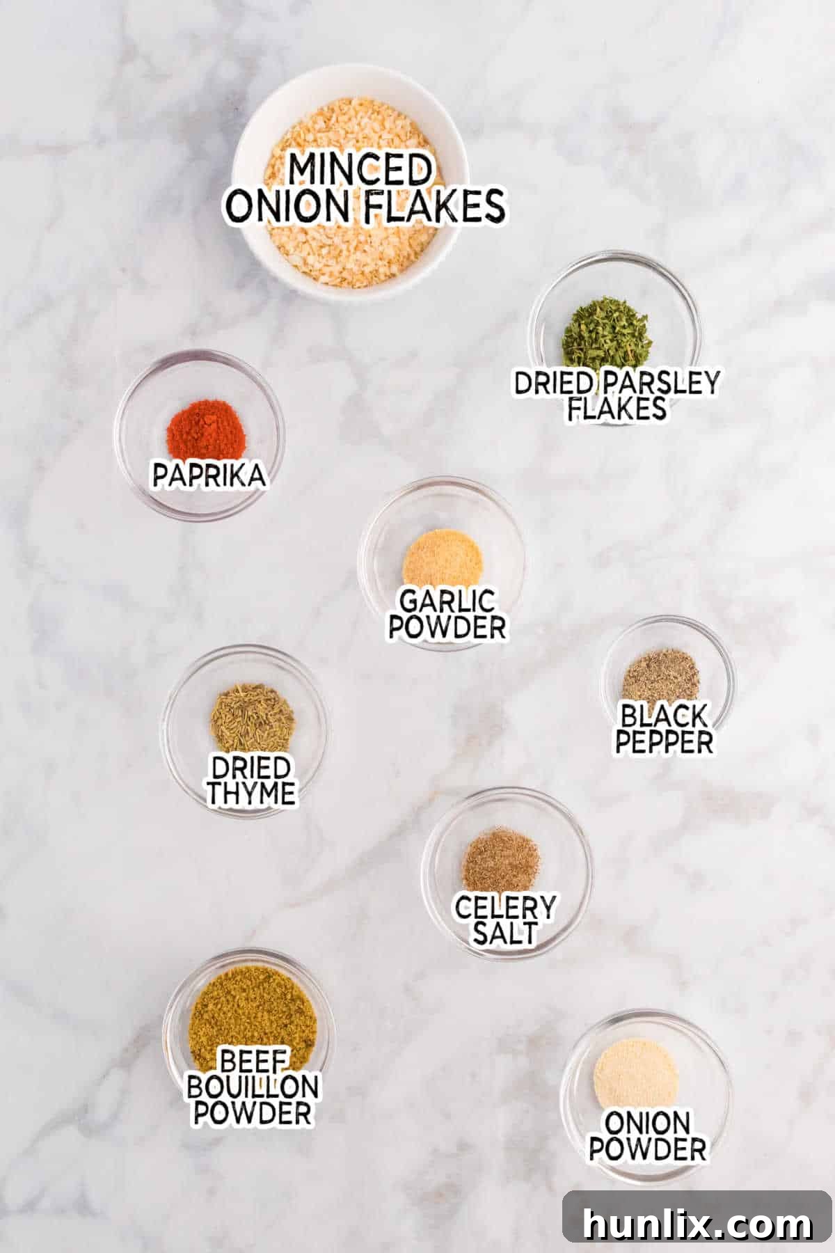 Aromatic Onion Seasoning 3 A collection of spices and dried herbs laid out on a surface, ready to be combined for homemade onion soup mix.