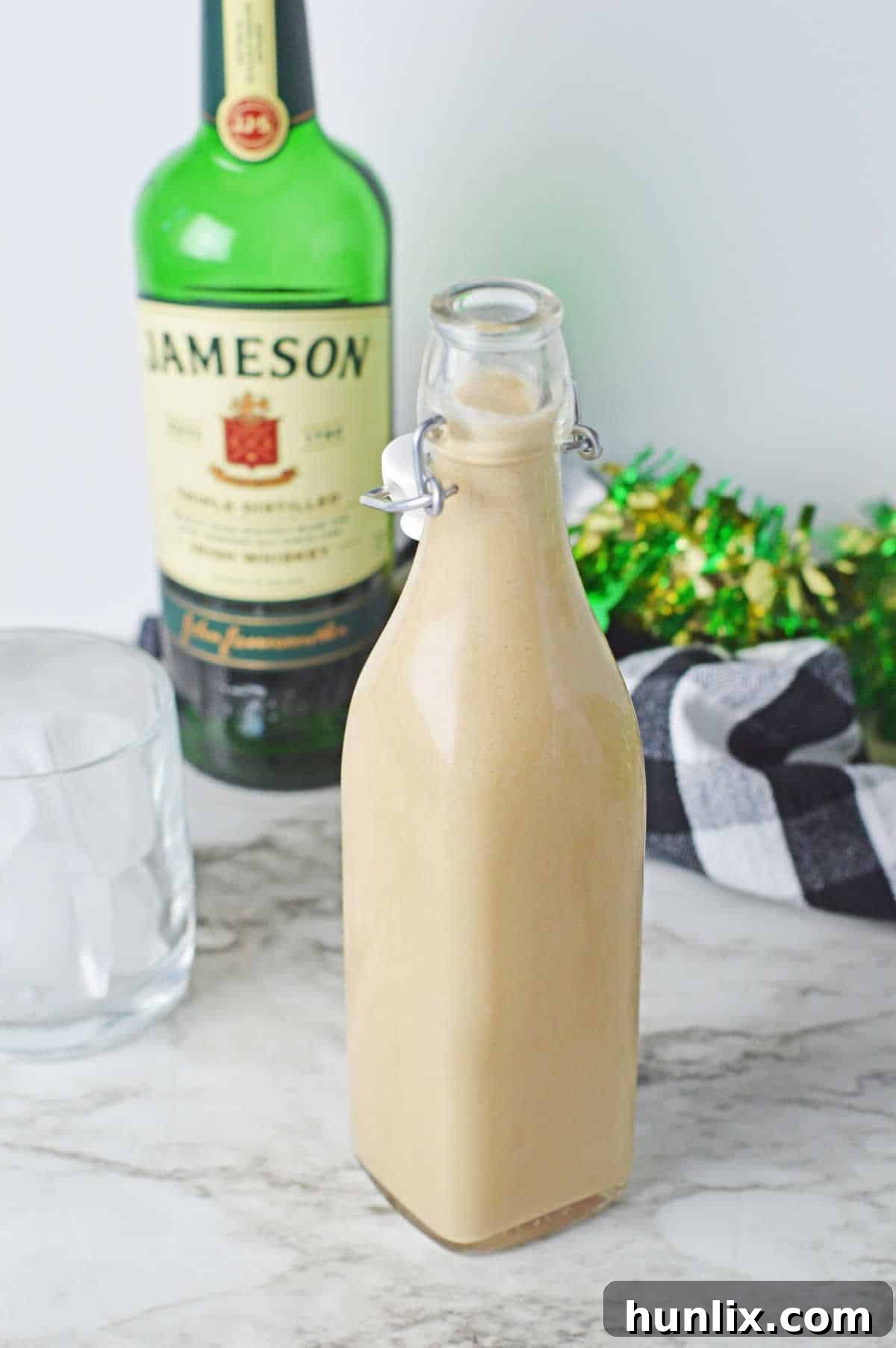 Homemade Irish Cream in a glass bottle.