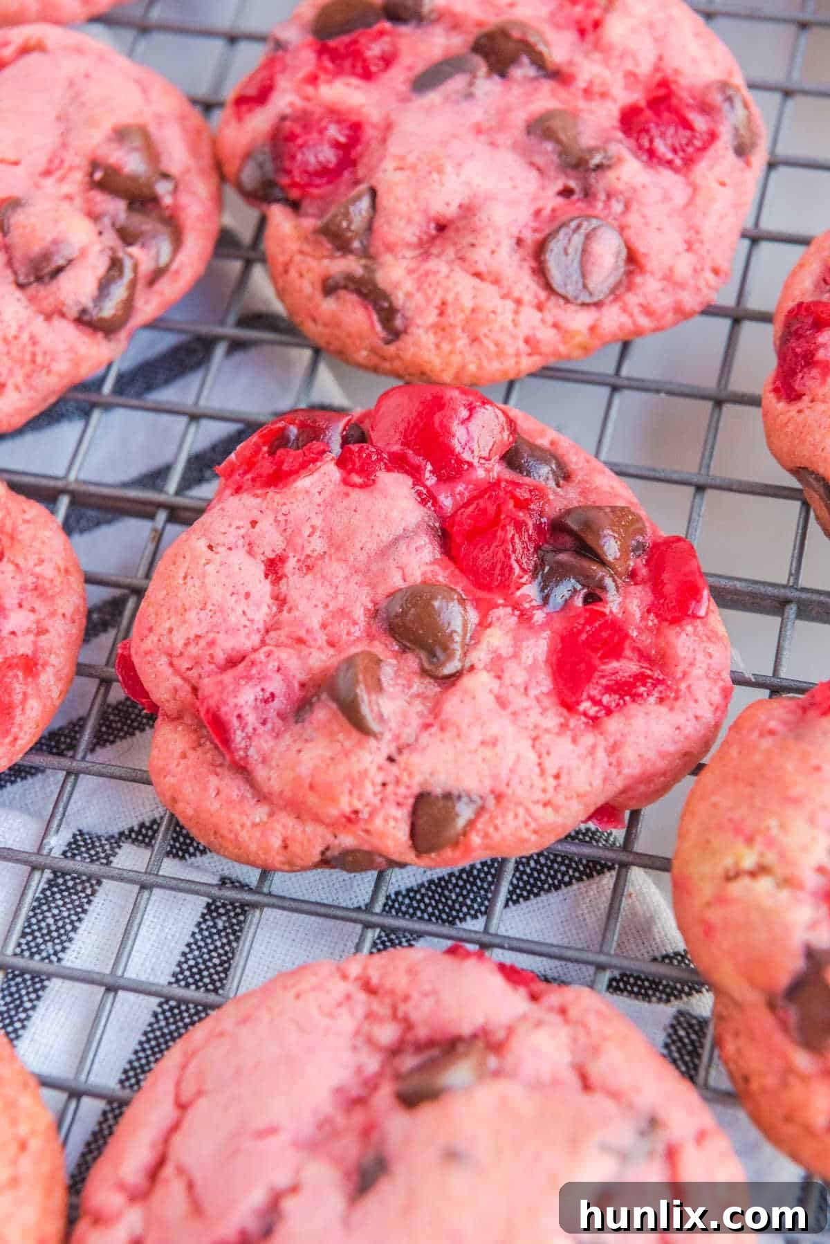 Cherry cookies on a wire rack.