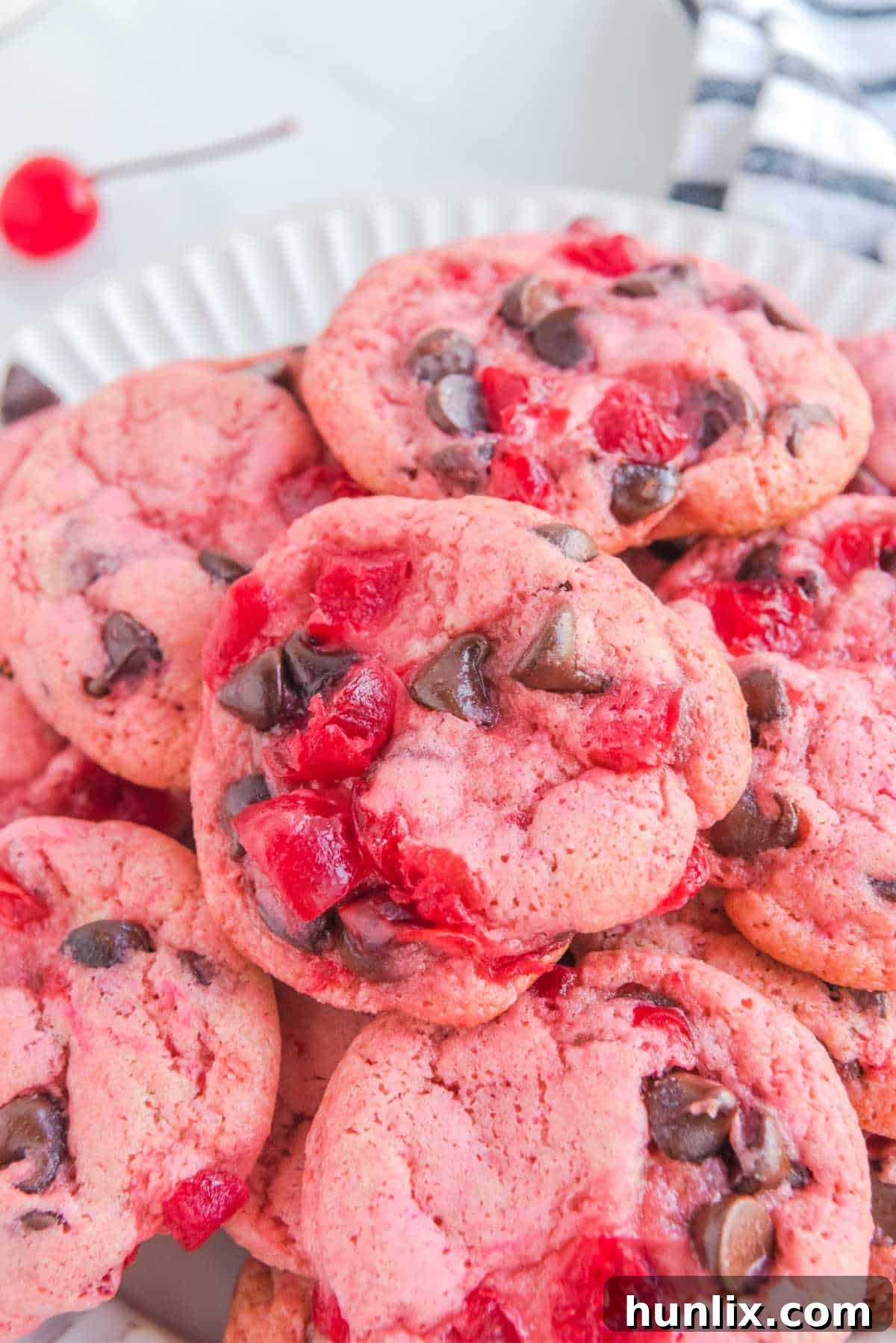 Cherry cookies piled together.