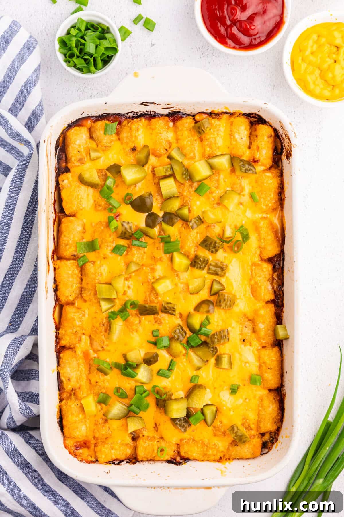 Cheeseburger tater tot casserole in a white casserole dish.