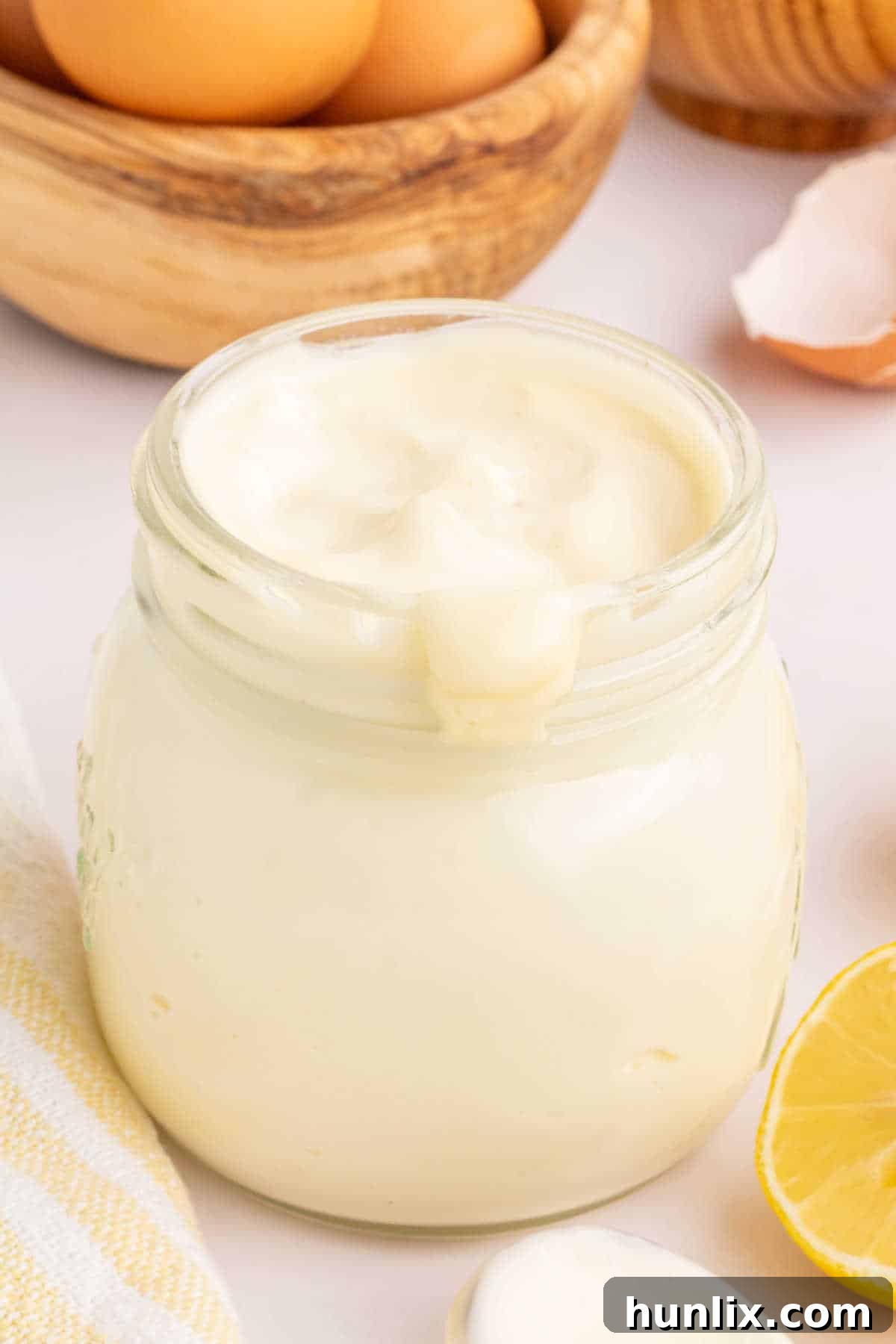 A jar of freshly made homemade mayonnaise ready for use.
