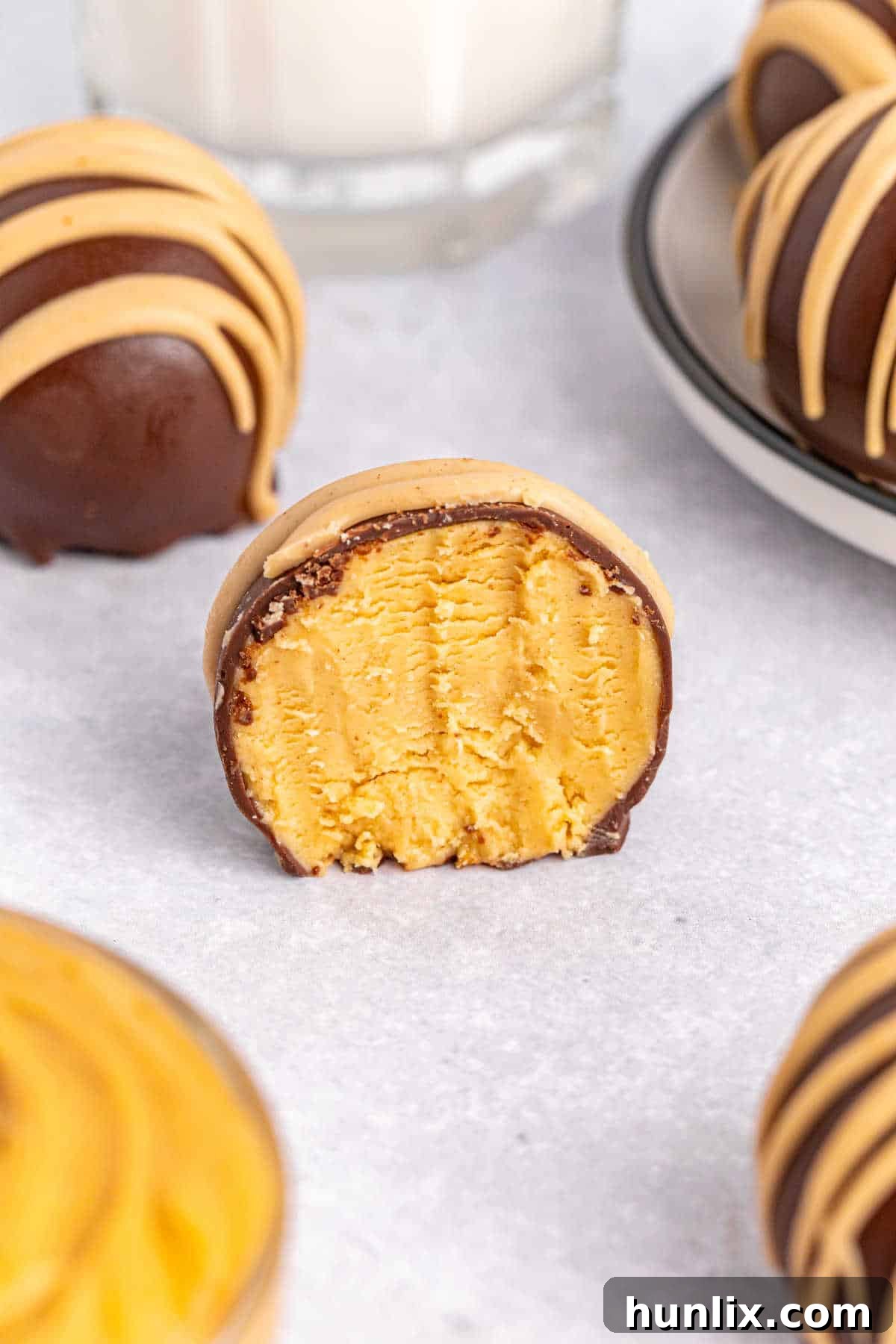 Choco-Peanut Butter Bliss Balls 11 A ball with a bite out of it.