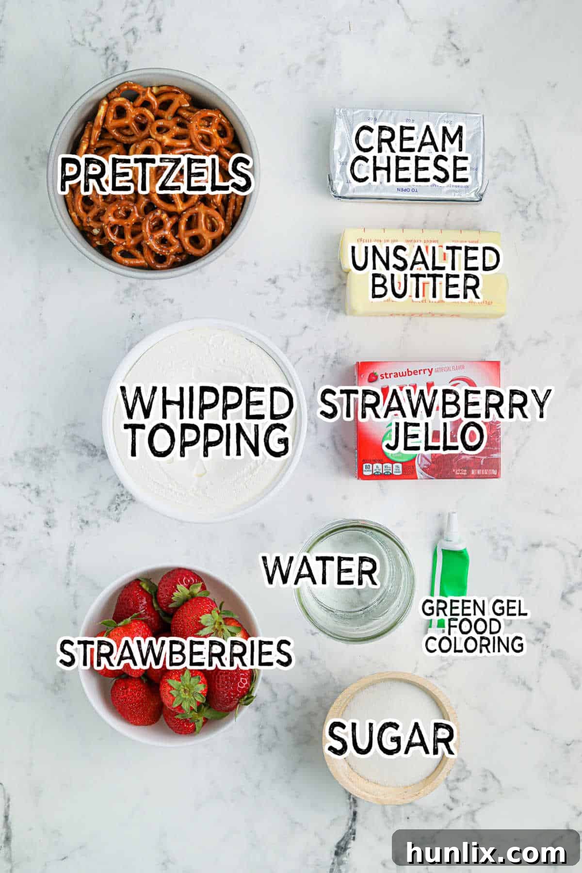 Sweet & Salty Christmas Pretzel Delight 3 A flat lay of all the ingredients required to make Christmas Pretzel Salad, neatly arranged on a white surface.