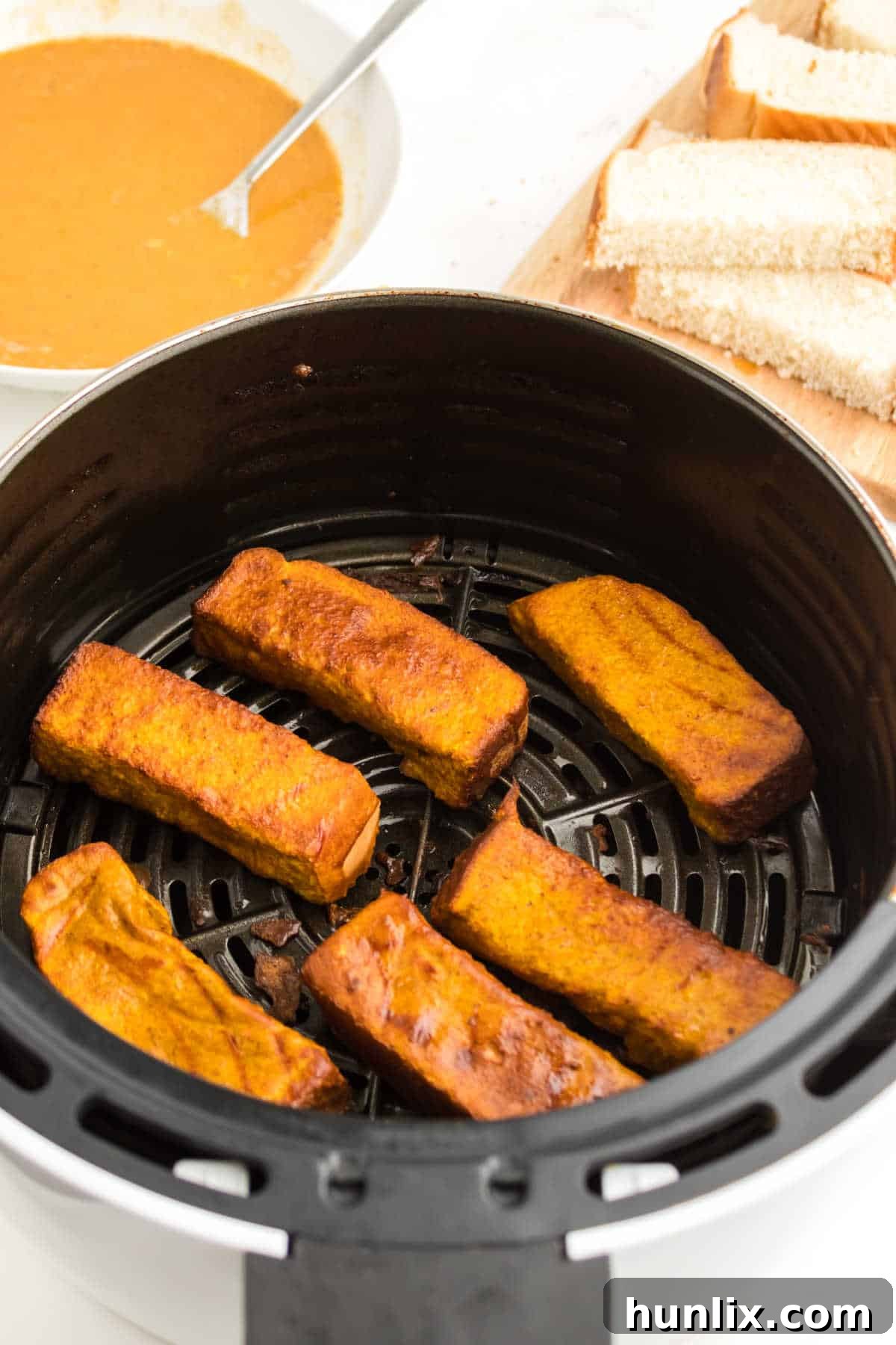 Crispy Air Fryer Pumpkin French Toast Sticks on a plate, ready to be served.
