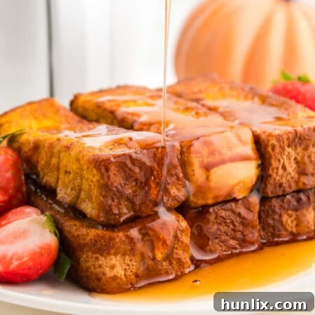 The recipe on a plate with maple syrup being drizzled on top.