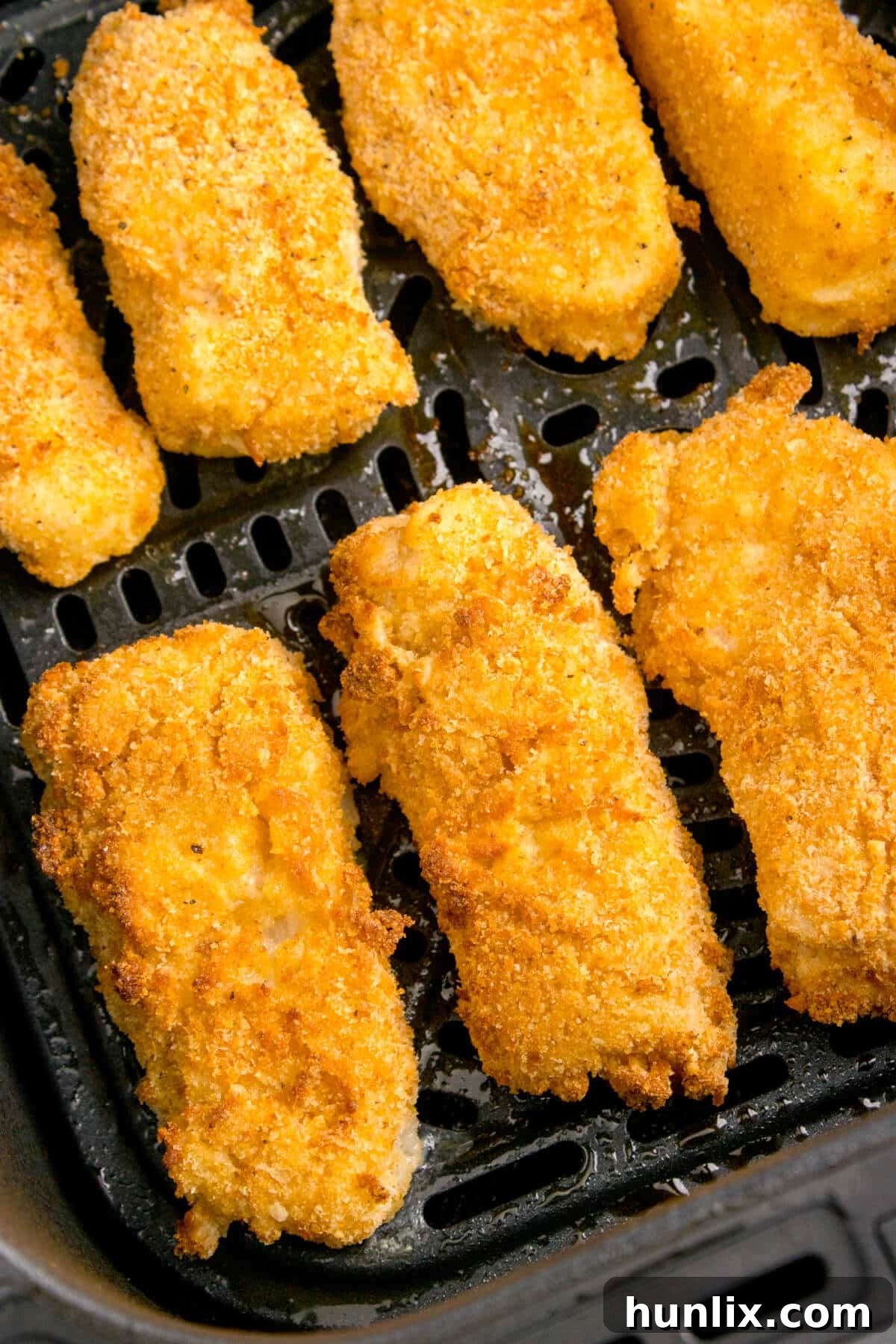 Fish sticks cooked to golden perfection in an air fryer.