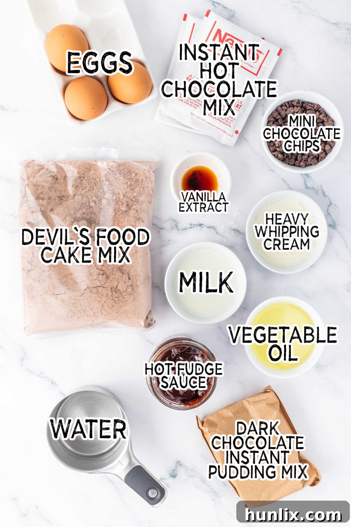 Decadent Triple Chocolate Poke Cake 3 Ingredients on a white marble surface.