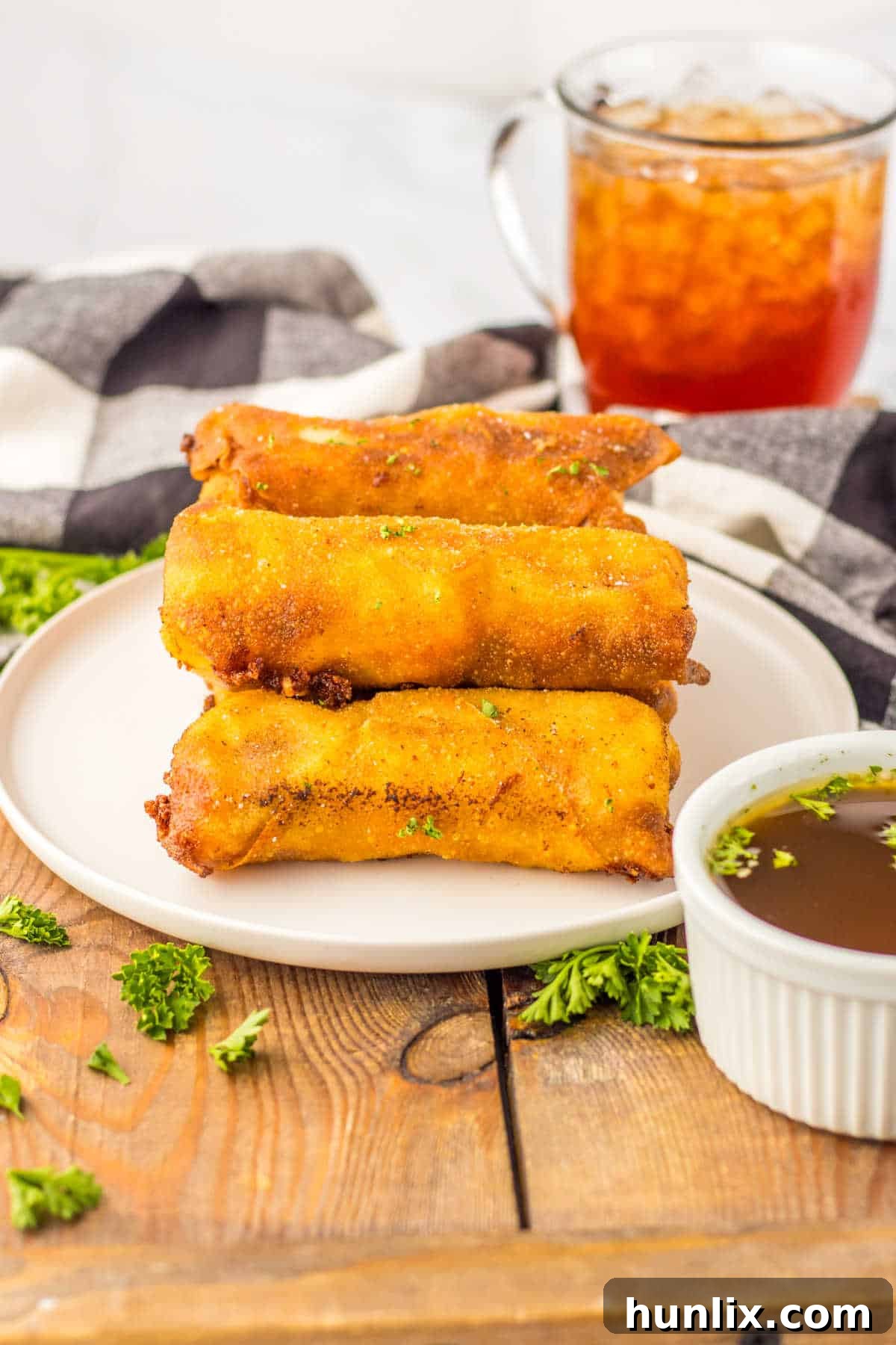 Crispy French Dip Dippers 2 Crispy French dip egg rolls arranged beautifully on a serving plate, ready to be enjoyed.