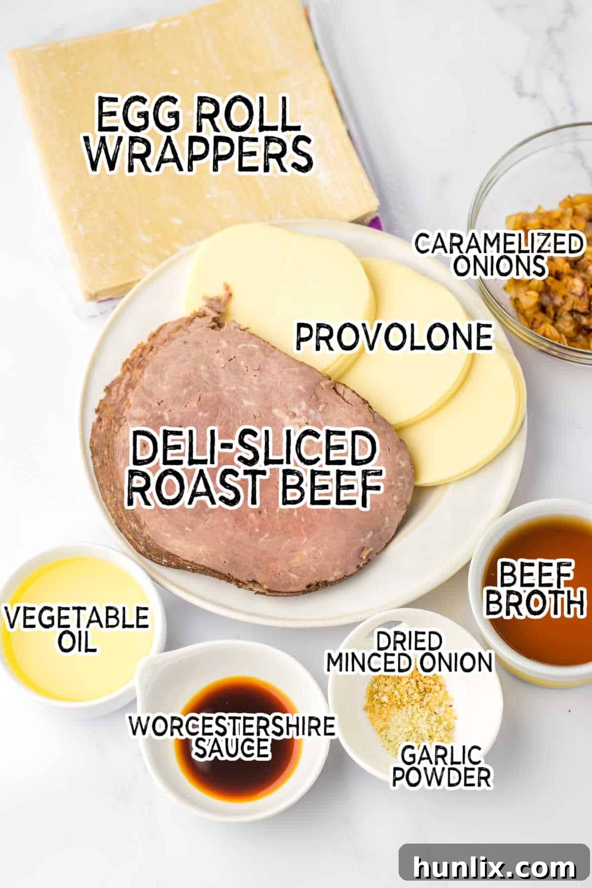 Crispy French Dip Dippers 3 All the fresh ingredients laid out on a counter, ready for assembly of French dip egg rolls.