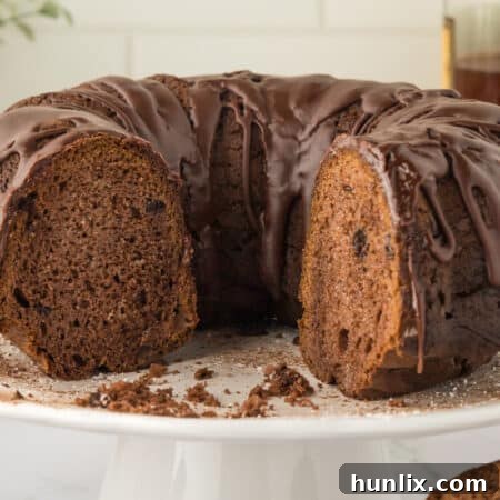 Cake on a plate with a slice removed.