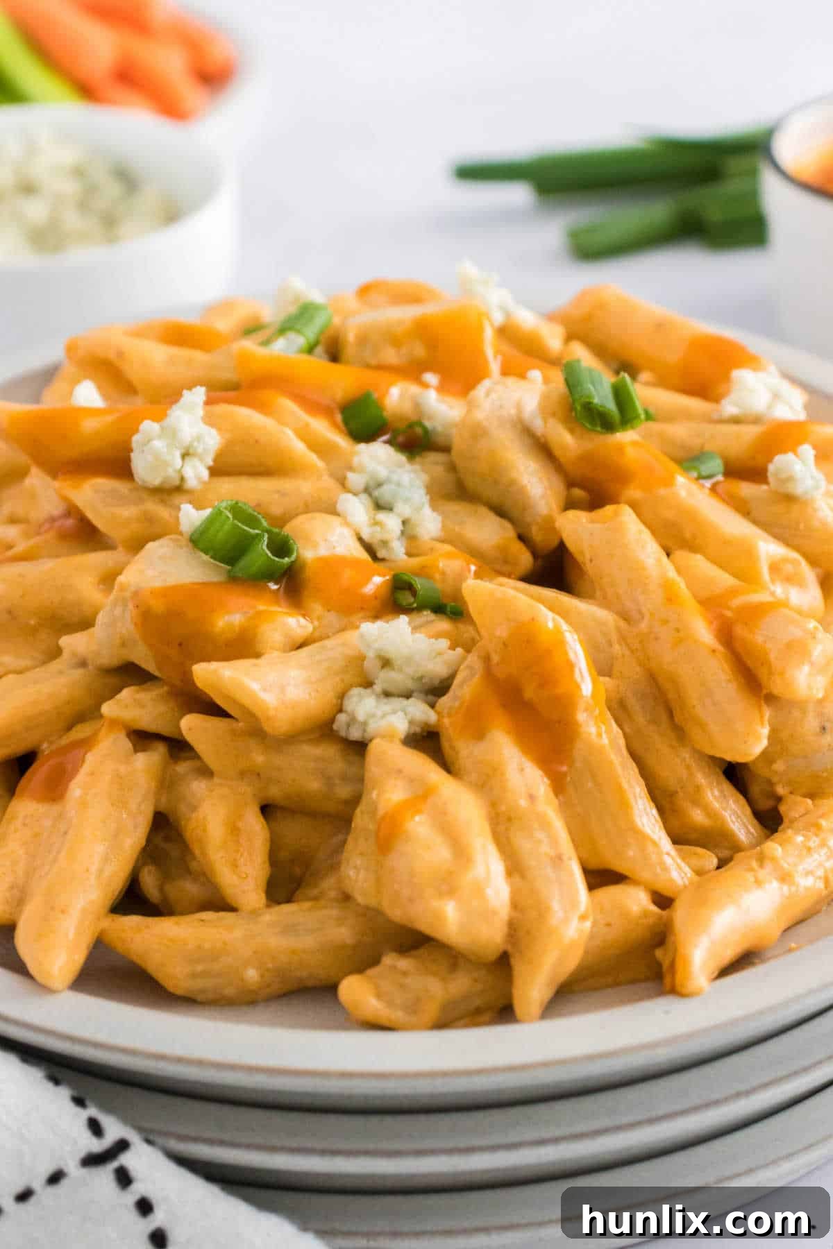 Kickin Buffalo Chicken Pasta 7 A plate of buffalo chicken pasta, garnished and ready to eat.