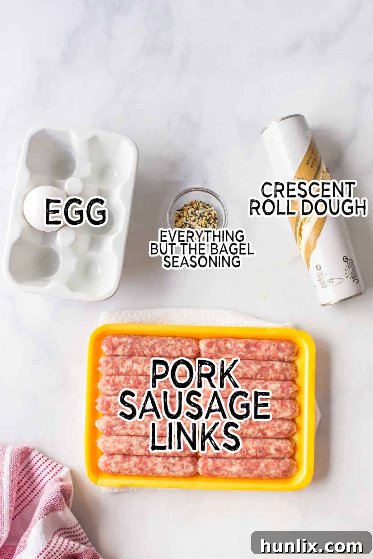 Ingredients laid out on a kitchen counter for making breakfast pigs in a blanket.