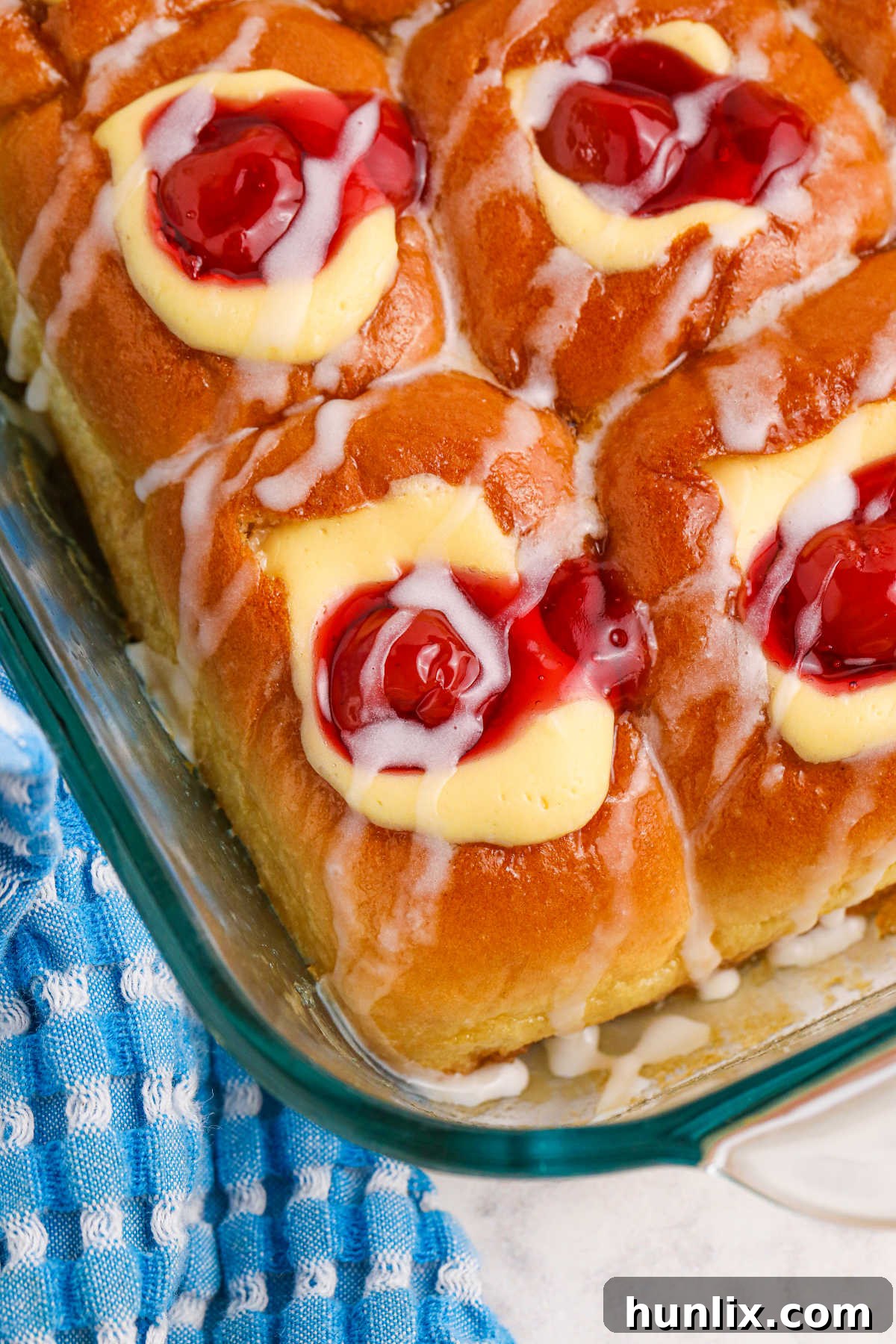 Cherry Hawaiian Danishes in a pan, beautifully arranged and ready to serve.