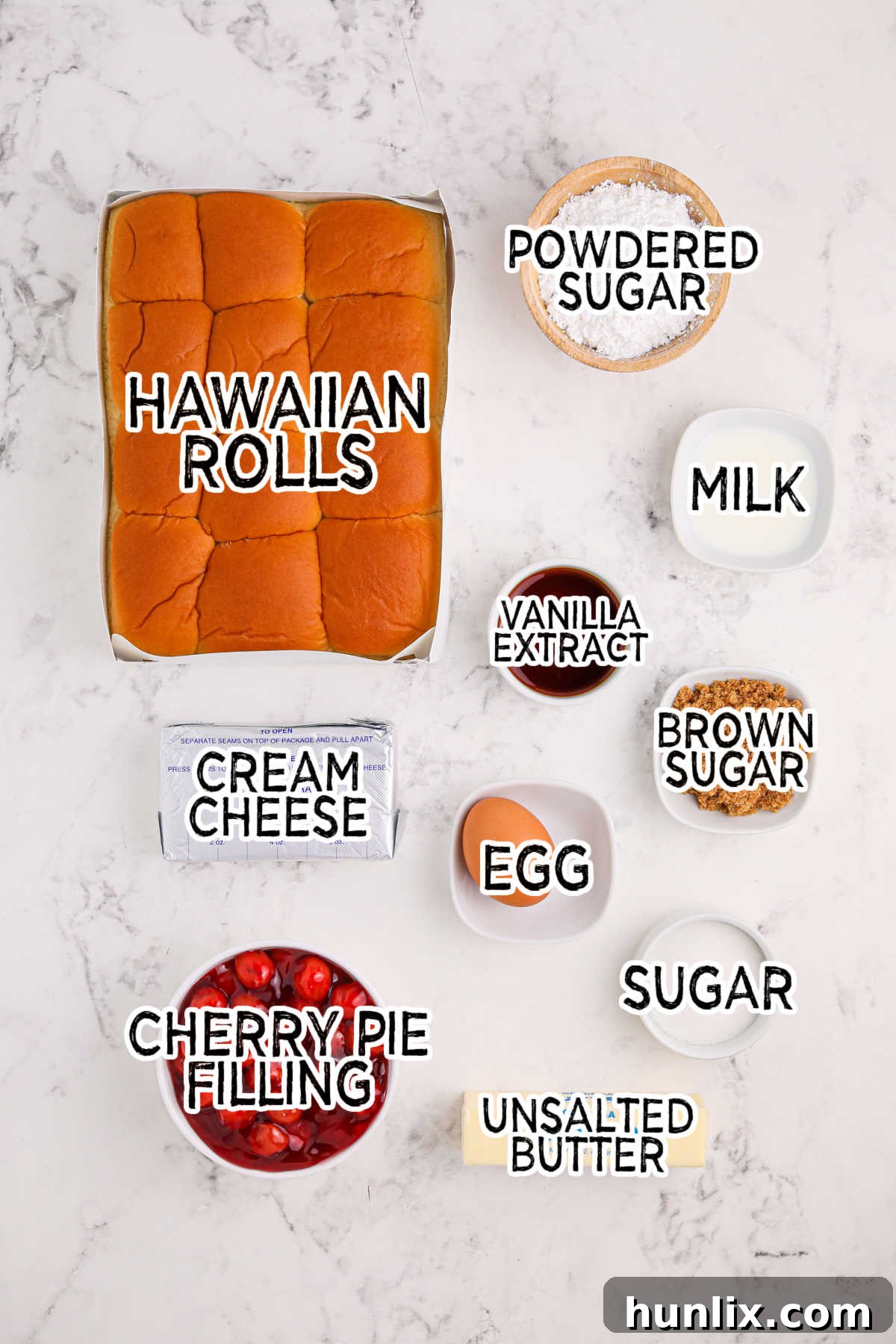 Ingredients to make Cherry Hawaiian Danishes, neatly laid out on a wooden surface.
