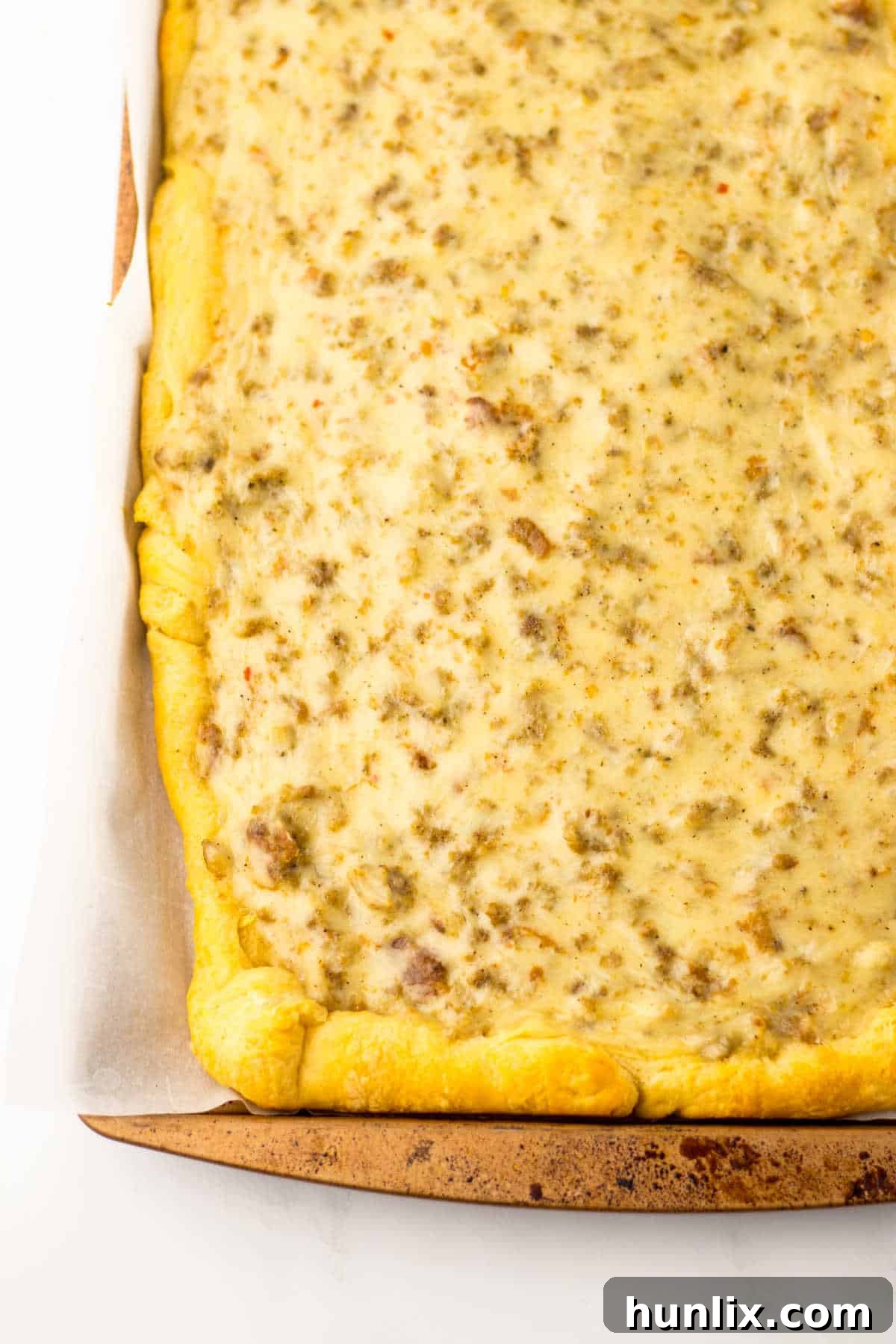 A vibrant School Breakfast Pizza sliced on a sheet pan, ready to be served.