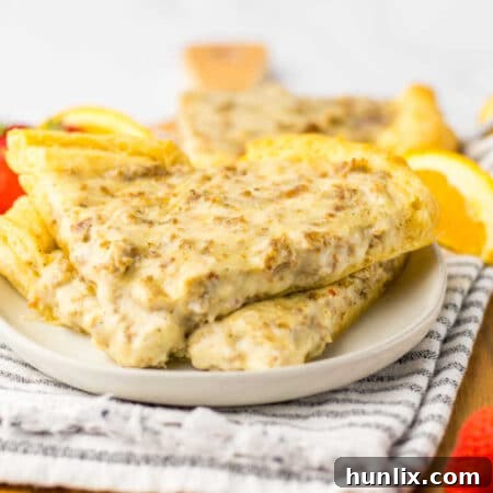 A delicious slice of School Breakfast Pizza on a plate.