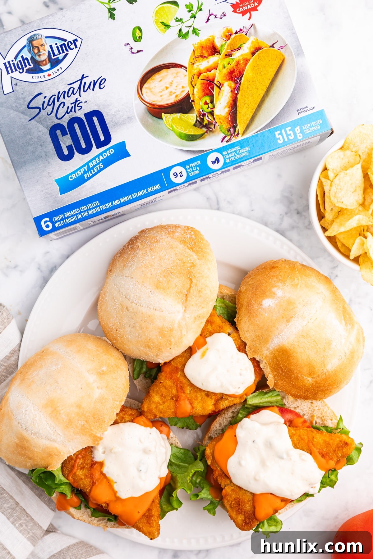 Buffalo cod filet sandwiches on a plate, ready to be served.