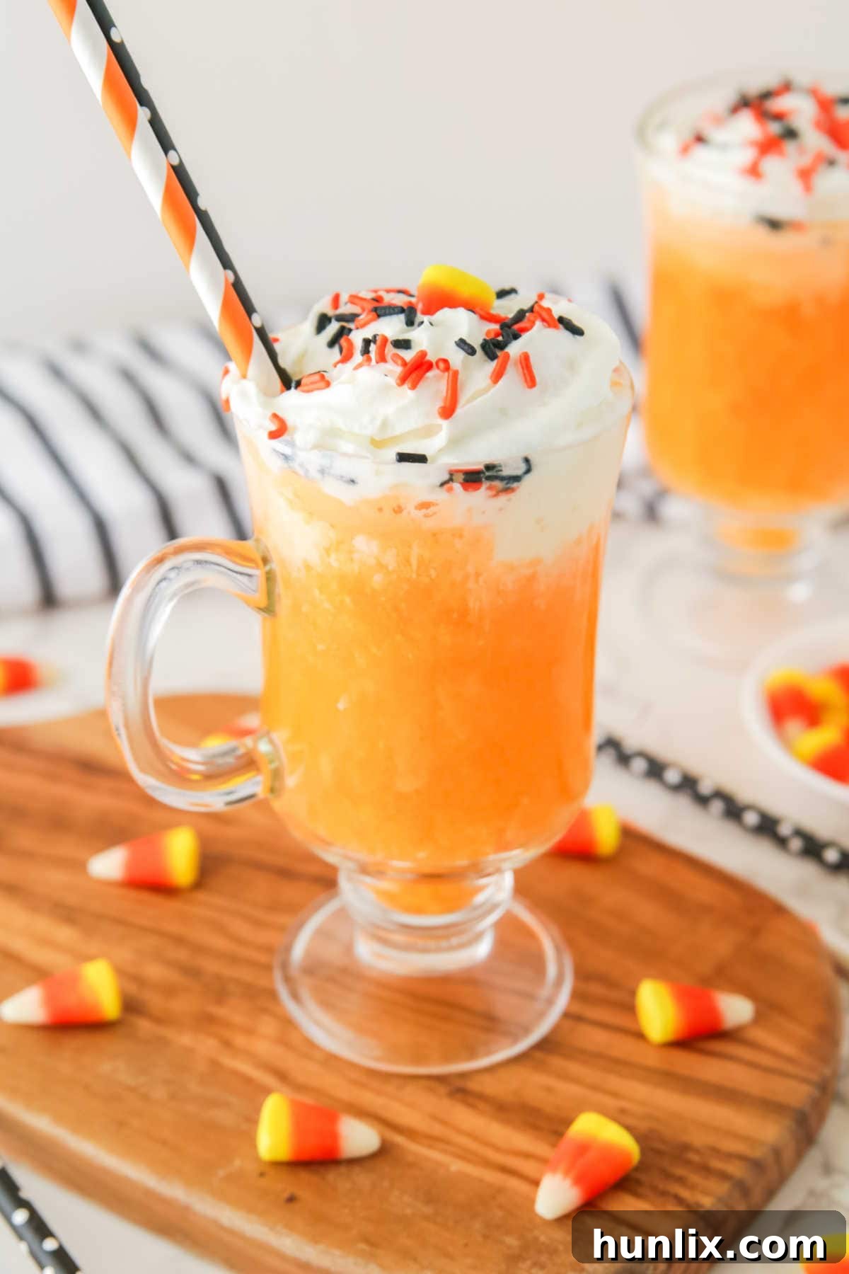 Halloween ice cream floats on a wooden board.