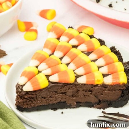 Candy Corn Pie, a rich fudgy brownie pie with a sweet and colorful candy corn topping.