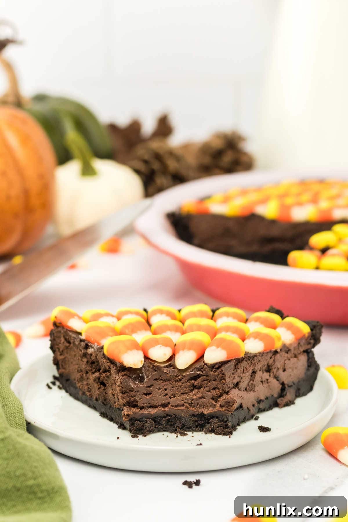 A slice of Candy Corn Pie plated beautifully, ready to be enjoyed with a fork.
