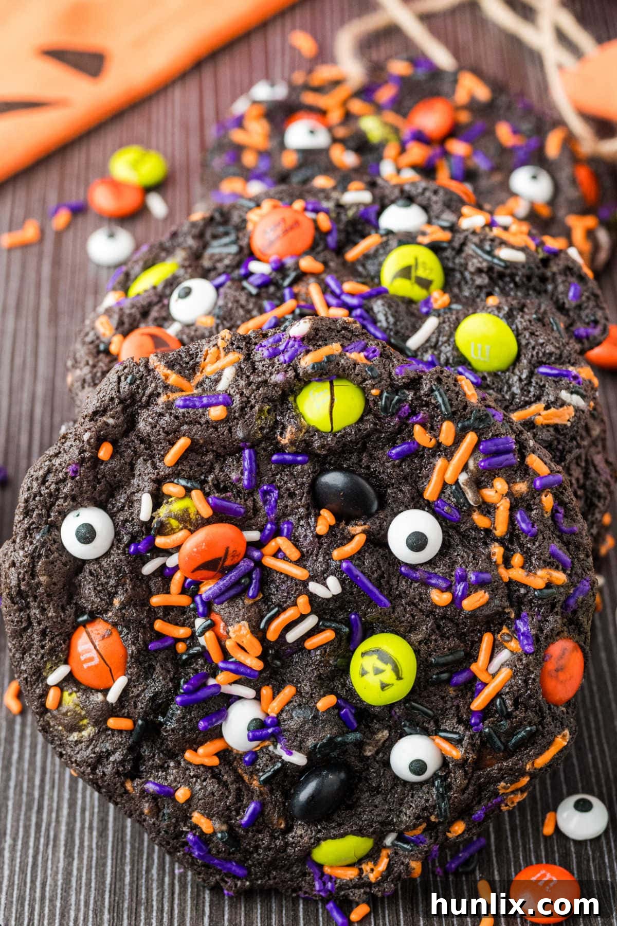 Halloween cookies on a dark surface.